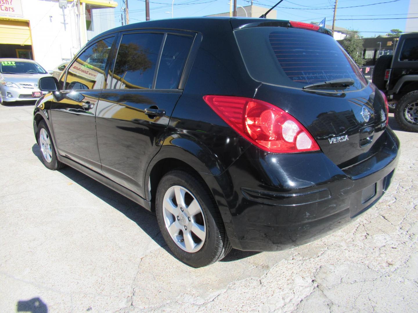 2012 Black /Black Nissan Versa 1.8 SL Hatchback (3N1BC1CP0CK) with an 1.8L L4 DOHC 16V engine, Continuously Variable Transmission transmission, located at 1511 North Shepherd Dr., Houston, TX, 77008, (281) 657-1221, 29.798361, -95.412560 - 2012 NISSAN VERSA 1.8 S VIN: 3N1BC1CP0CK257268 3 N 1 B C 1 C P 0 C K 2 5 7 2 6 8 HATCHBACK 4 DR 1.8L I4 F DOHC 16V GASOLINE FRONT WHEEL DRIVE - Photo#13
