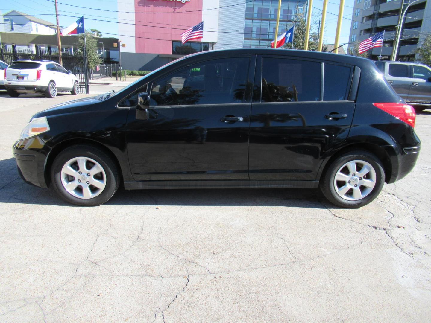 2012 Black /Black Nissan Versa 1.8 SL Hatchback (3N1BC1CP0CK) with an 1.8L L4 DOHC 16V engine, Continuously Variable Transmission transmission, located at 1511 North Shepherd Dr., Houston, TX, 77008, (281) 657-1221, 29.798361, -95.412560 - 2012 NISSAN VERSA 1.8 S VIN: 3N1BC1CP0CK257268 3 N 1 B C 1 C P 0 C K 2 5 7 2 6 8 HATCHBACK 4 DR 1.8L I4 F DOHC 16V GASOLINE FRONT WHEEL DRIVE - Photo#16