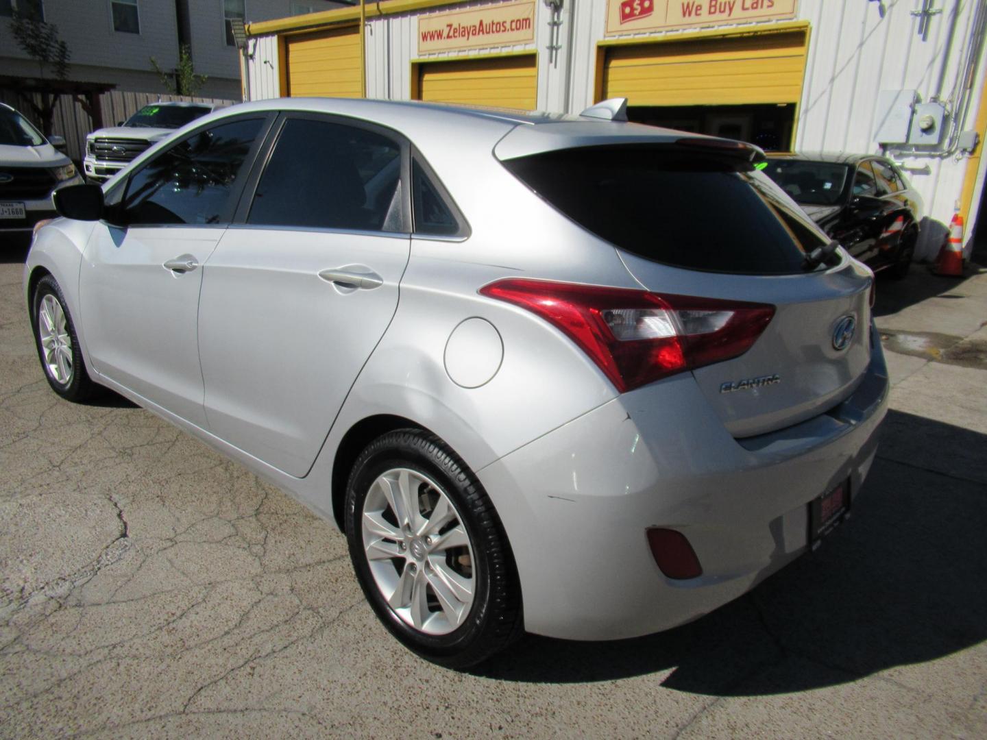 2013 Silver /Black Hyundai Elantra GT A/T (KMHD35LE8DU) with an 1.8L L4 16V DOHC engine, 6-Speed Automatic transmission, located at 1511 North Shepherd Dr., Houston, TX, 77008, (281) 657-1221, 29.798361, -95.412560 - 2013 HYUNDAI ELANTRA GT VIN: KMHD35LE8DU131541 K M H D 3 5 L E 8 D U 1 3 1 5 4 1 HATCHBACK 4 DR 1.8L I4 F DOHC 16V GASOLINE FRONT WHEEL DRIVE - Photo#18