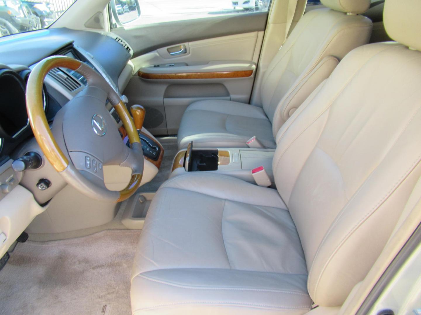 2009 Gold /Tan Lexus RX 350 FWD (2T2GK31U79C) with an 3.5L V6 DOHC 24V engine, 5-Speed Automatic Overdrive transmission, located at 1511 North Shepherd Dr., Houston, TX, 77008, (281) 657-1221, 29.798361, -95.412560 - 2009 LEXUS RX 350 VIN: 2T2GK31U79C066748 2 T 2 G K 3 1 U 7 9 C 0 6 6 7 4 8 4 DOOR WAGON/SPORT UTILITY 3.5L V6 F DOHC 24V GASOLINE FRONT WHEEL DRIVE - Photo#2