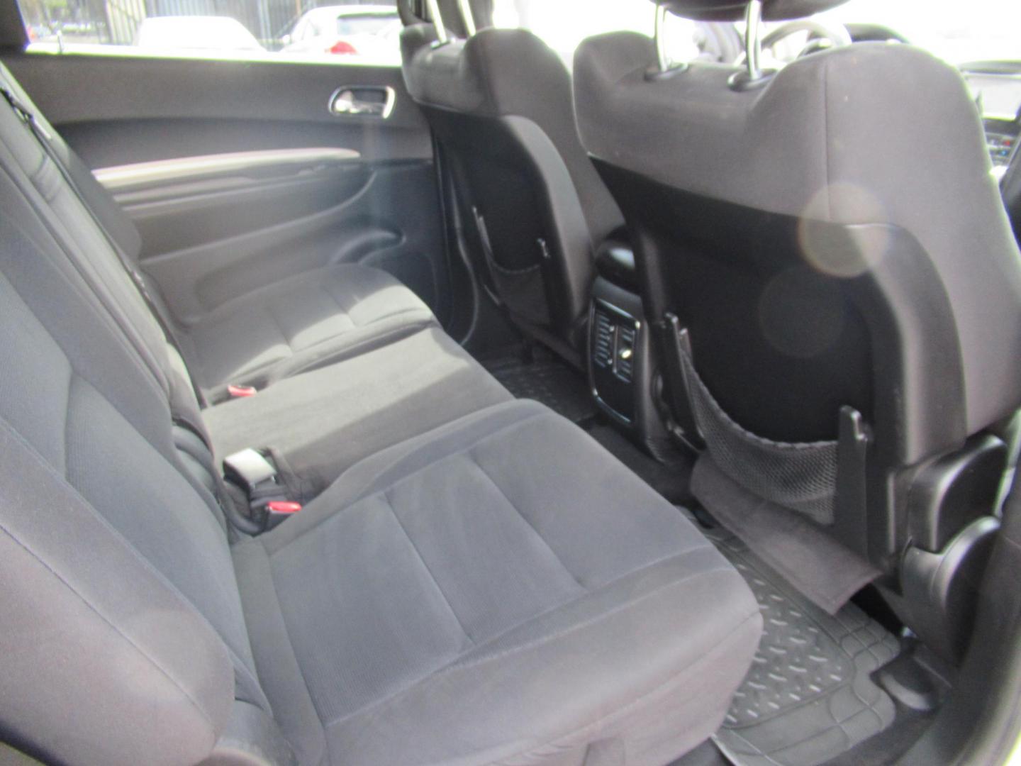 2013 White /Black Dodge Durango SXT RWD (1C4RDHAG3DC) with an 3.6L V6 DOHC 24V engine, Automatic transmission, located at 1511 North Shepherd Dr., Houston, TX, 77008, (281) 657-1221, 29.798361, -95.412560 - 2013 DODGE DURANGO SXT VIN: 1C4RDHAG3DC694368 1 C 4 R D H A G 3 D C 6 9 4 3 6 8 4 DOOR WAGON/SPORT UTILITY 3.6L V6 F DOHC 24V GASOLINE REAR WHEEL DRIVE - Photo#12