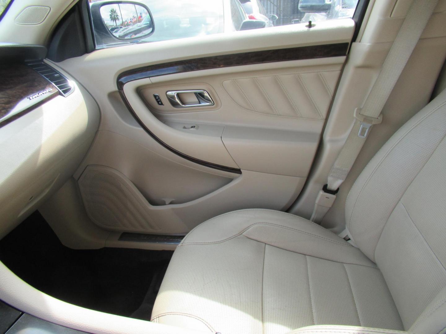 2013 White /Tan Ford Taurus Limited FWD (1FAHP2F87DG) with an 3.5L V6 DOHC 24V engine, 6-Speed Automatic transmission, located at 1511 North Shepherd Dr., Houston, TX, 77008, (281) 657-1221, 29.798361, -95.412560 - 2013 FORD TAURUS LIMITED VIN: 1FAHP2F87DG147989 1 F A H P 2 F 8 7 D G 1 4 7 9 8 9 SEDAN 4 DR 3.5L V6 F DOHC 24V GASOLINE FRONT WHEEL DRIVE- Photo#3