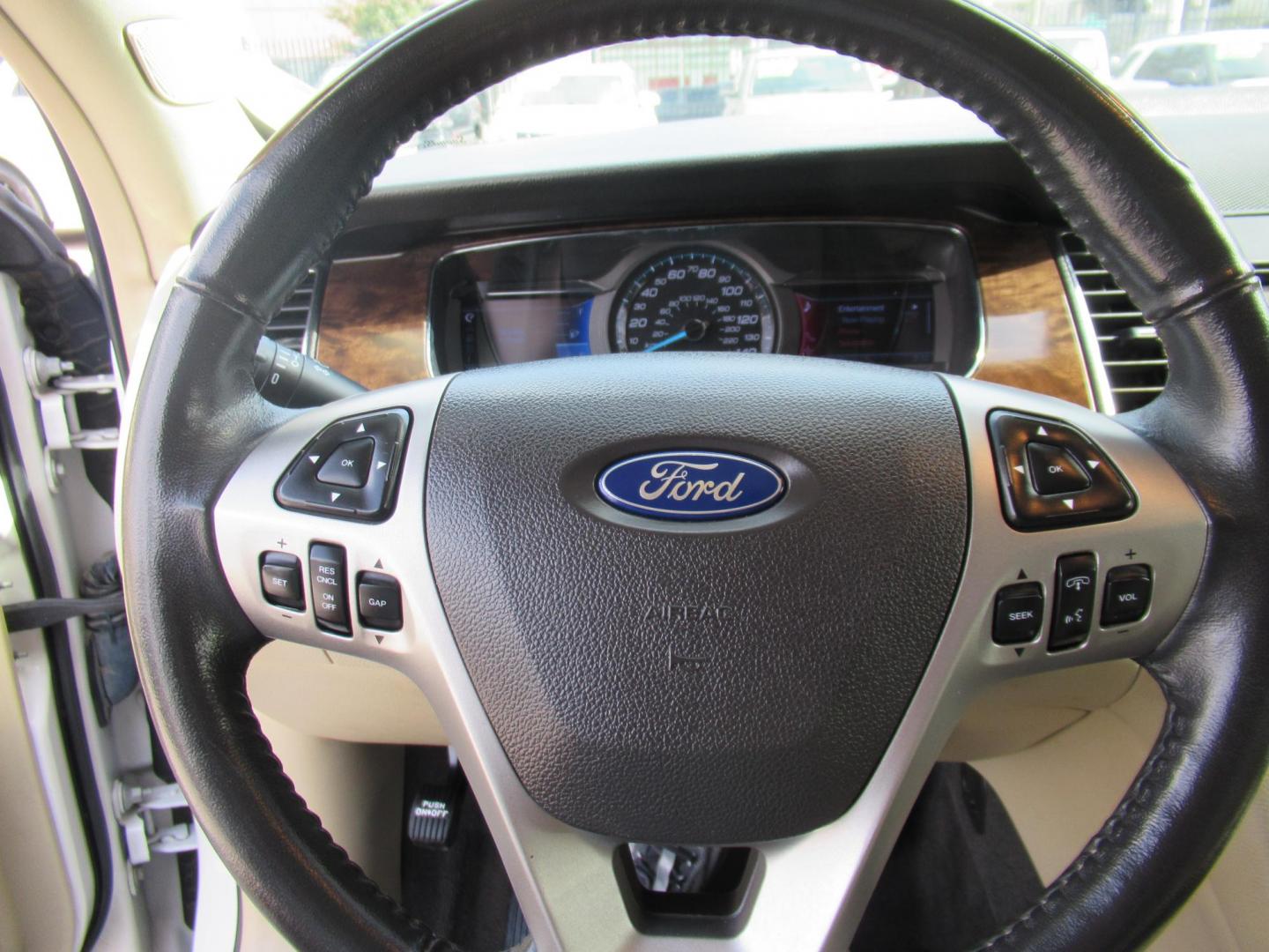 2013 White /Tan Ford Taurus Limited FWD (1FAHP2F87DG) with an 3.5L V6 DOHC 24V engine, 6-Speed Automatic transmission, located at 1511 North Shepherd Dr., Houston, TX, 77008, (281) 657-1221, 29.798361, -95.412560 - 2013 FORD TAURUS LIMITED VIN: 1FAHP2F87DG147989 1 F A H P 2 F 8 7 D G 1 4 7 9 8 9 SEDAN 4 DR 3.5L V6 F DOHC 24V GASOLINE FRONT WHEEL DRIVE- Photo#4