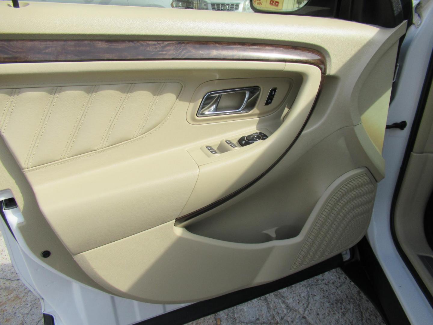 2013 White /Tan Ford Taurus Limited FWD (1FAHP2F87DG) with an 3.5L V6 DOHC 24V engine, 6-Speed Automatic transmission, located at 1511 North Shepherd Dr., Houston, TX, 77008, (281) 657-1221, 29.798361, -95.412560 - 2013 FORD TAURUS LIMITED VIN: 1FAHP2F87DG147989 1 F A H P 2 F 8 7 D G 1 4 7 9 8 9 SEDAN 4 DR 3.5L V6 F DOHC 24V GASOLINE FRONT WHEEL DRIVE- Photo#5