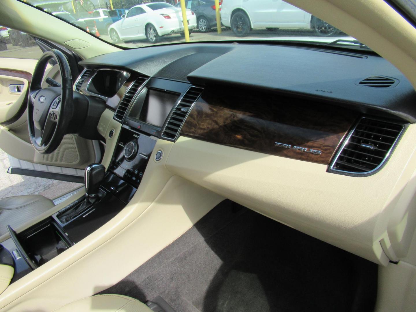 2013 White /Tan Ford Taurus Limited FWD (1FAHP2F87DG) with an 3.5L V6 DOHC 24V engine, 6-Speed Automatic transmission, located at 1511 North Shepherd Dr., Houston, TX, 77008, (281) 657-1221, 29.798361, -95.412560 - 2013 FORD TAURUS LIMITED VIN: 1FAHP2F87DG147989 1 F A H P 2 F 8 7 D G 1 4 7 9 8 9 SEDAN 4 DR 3.5L V6 F DOHC 24V GASOLINE FRONT WHEEL DRIVE- Photo#10