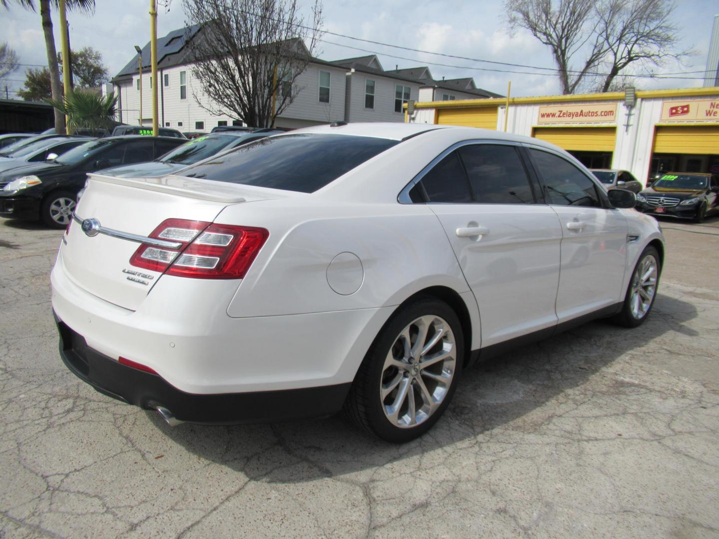 2013 White /Tan Ford Taurus Limited FWD (1FAHP2F87DG) with an 3.5L V6 DOHC 24V engine, 6-Speed Automatic transmission, located at 1511 North Shepherd Dr., Houston, TX, 77008, (281) 657-1221, 29.798361, -95.412560 - 2013 FORD TAURUS LIMITED VIN: 1FAHP2F87DG147989 1 F A H P 2 F 8 7 D G 1 4 7 9 8 9 SEDAN 4 DR 3.5L V6 F DOHC 24V GASOLINE FRONT WHEEL DRIVE- Photo#16