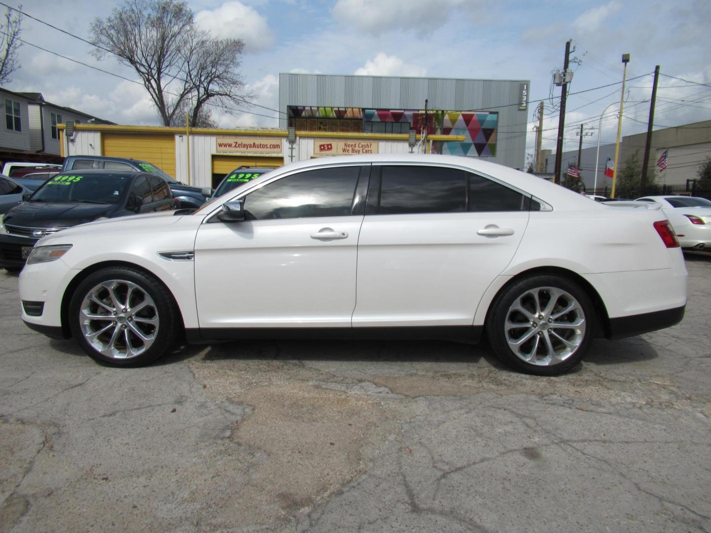 2013 White /Tan Ford Taurus Limited FWD (1FAHP2F87DG) with an 3.5L V6 DOHC 24V engine, 6-Speed Automatic transmission, located at 1511 North Shepherd Dr., Houston, TX, 77008, (281) 657-1221, 29.798361, -95.412560 - 2013 FORD TAURUS LIMITED VIN: 1FAHP2F87DG147989 1 F A H P 2 F 8 7 D G 1 4 7 9 8 9 SEDAN 4 DR 3.5L V6 F DOHC 24V GASOLINE FRONT WHEEL DRIVE- Photo#19