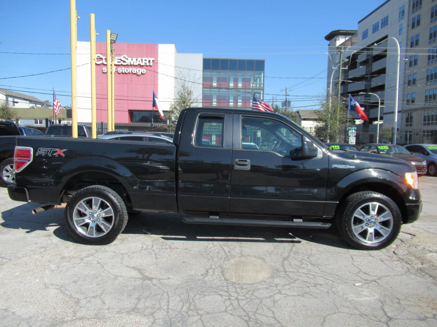 2014 Black /Gray Ford F-150 XLT SuperCab 8-ft. Bed 2WD (1FTEX1CM4EF) with an 3.7L V6 DOHC 24V engine, Automatic transmission, located at 1511 North Shepherd Dr., Houston, TX, 77008, (281) 657-1221, 29.798361, -95.412560 - 2014 FORD F-150 STX VIN: 1FTEX1CM4EFA27907 1 F T E X 1 C M 4 E F A 2 7 9 0 7 4 DOOR EXTENDED CAB PICKUP 3.7L V6 F DOHC 24V FLEX FUEL REAR WHEEL DRIVE - Photo#0