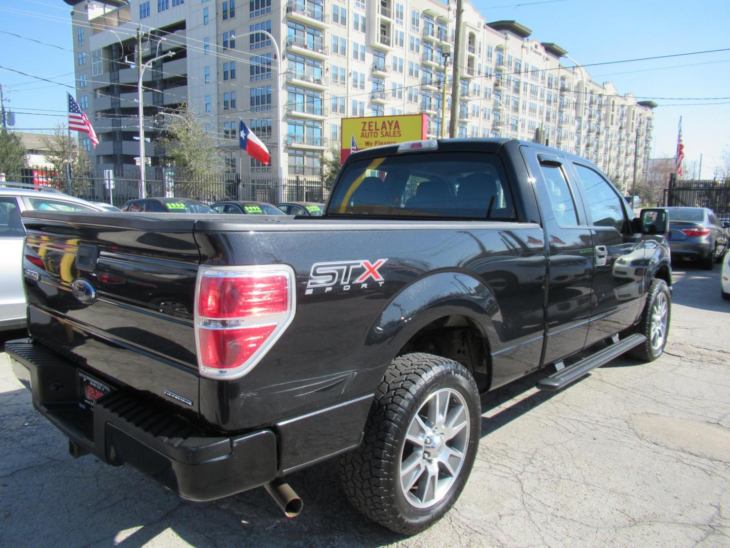 2014 Black /Gray Ford F-150 XLT SuperCab 8-ft. Bed 2WD (1FTEX1CM4EF) with an 3.7L V6 DOHC 24V engine, Automatic transmission, located at 1511 North Shepherd Dr., Houston, TX, 77008, (281) 657-1221, 29.798361, -95.412560 - 2014 FORD F-150 STX VIN: 1FTEX1CM4EFA27907 1 F T E X 1 C M 4 E F A 2 7 9 0 7 4 DOOR EXTENDED CAB PICKUP 3.7L V6 F DOHC 24V FLEX FUEL REAR WHEEL DRIVE - Photo#8