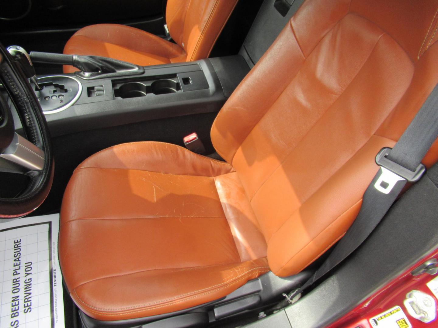 2008 Red /Brown Mazda MX-5 Miata Grand Touring Power Retractable Hardtop (JM1NC26F780) with an 2.0L L4 DOHC 16V engine, Automatic transmission, located at 1511 North Shepherd Dr., Houston, TX, 77008, (281) 657-1221, 29.798361, -95.412560 - 2008 Mazda MX-5 Miata Grand Touring 161,876 mi VIN: JM1NC26F780145276 Vehicle Details Convertible 2.0L I4 F DOHC 16V Gasoline Rear wheel drive- Photo#8