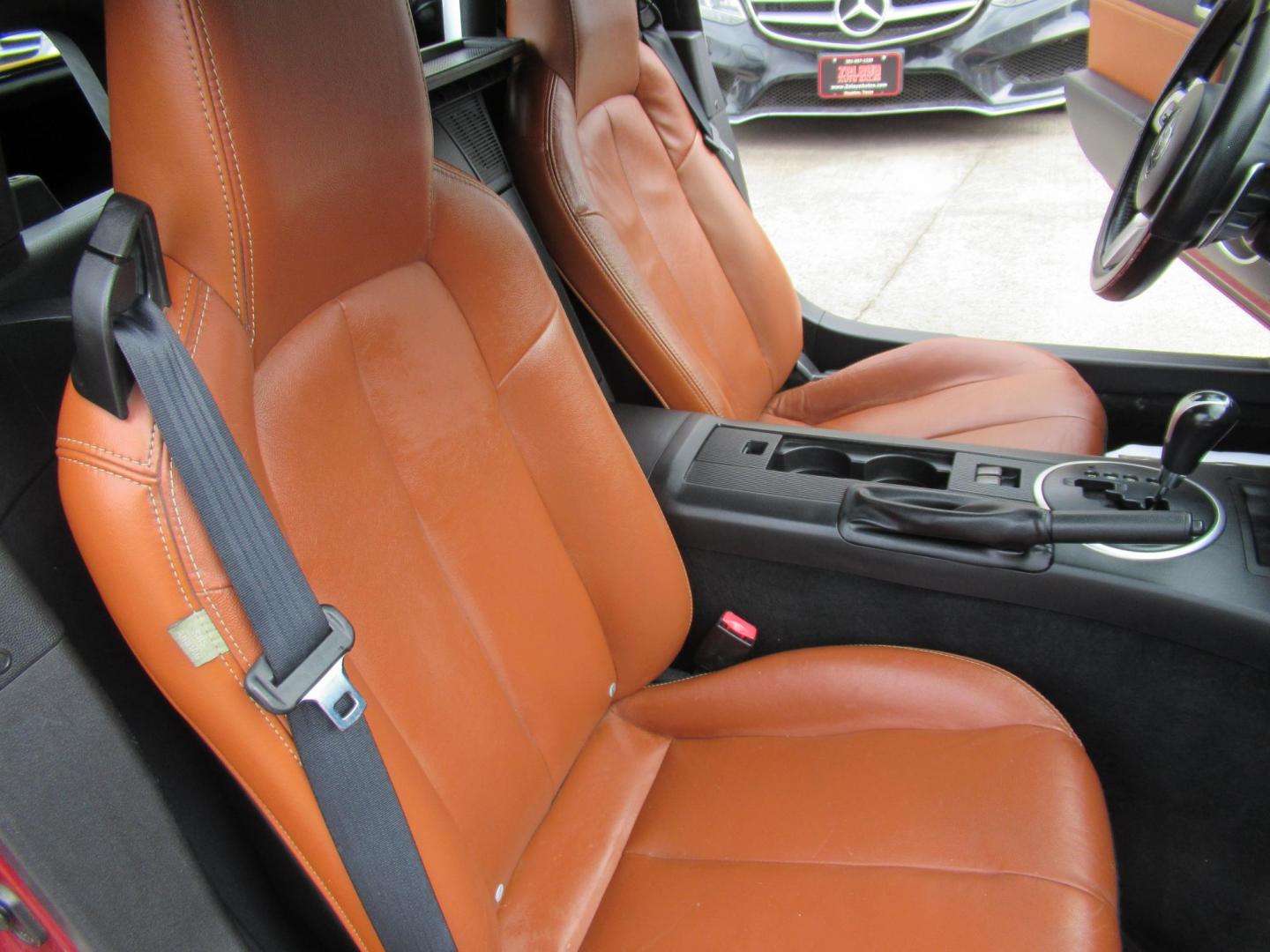 2008 Red /Brown Mazda MX-5 Miata Grand Touring Power Retractable Hardtop (JM1NC26F780) with an 2.0L L4 DOHC 16V engine, Automatic transmission, located at 1511 North Shepherd Dr., Houston, TX, 77008, (281) 657-1221, 29.798361, -95.412560 - 2008 Mazda MX-5 Miata Grand Touring 161,876 mi VIN: JM1NC26F780145276 Vehicle Details Convertible 2.0L I4 F DOHC 16V Gasoline Rear wheel drive- Photo#12