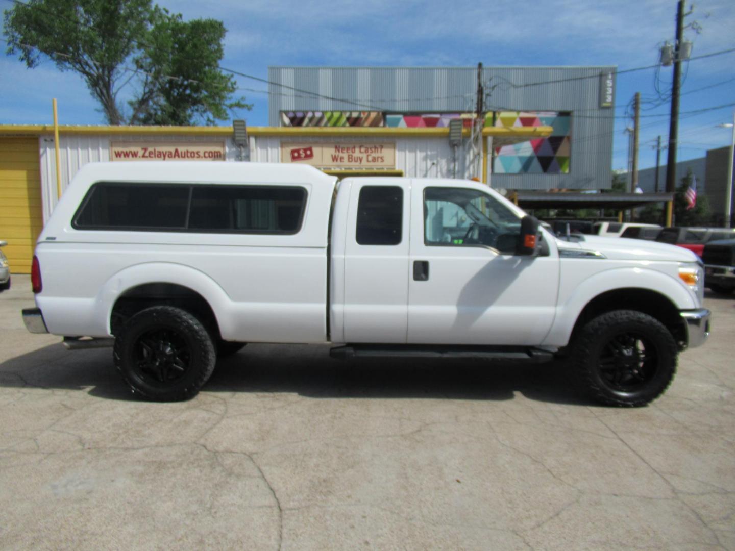 2015 White /Gray Ford F-250 SD XLT SuperCab Long Bed 4WD (1FT7X2B69FE) with an 6.2L V8 OHV 16V engine, Automatic transmission, located at 1511 North Shepherd Dr., Houston, TX, 77008, (281) 657-1221, 29.798361, -95.412560 - 2015 Ford F-250 Super Duty XLT 218,902 mi VIN: 1FT7X2B69FEA75606 Vehicle Details 4 Door Extended Cab Pickup 6.2L V8 F SOHC 16V Gasoline Rear wheel drive w/ 4X4- Photo#0