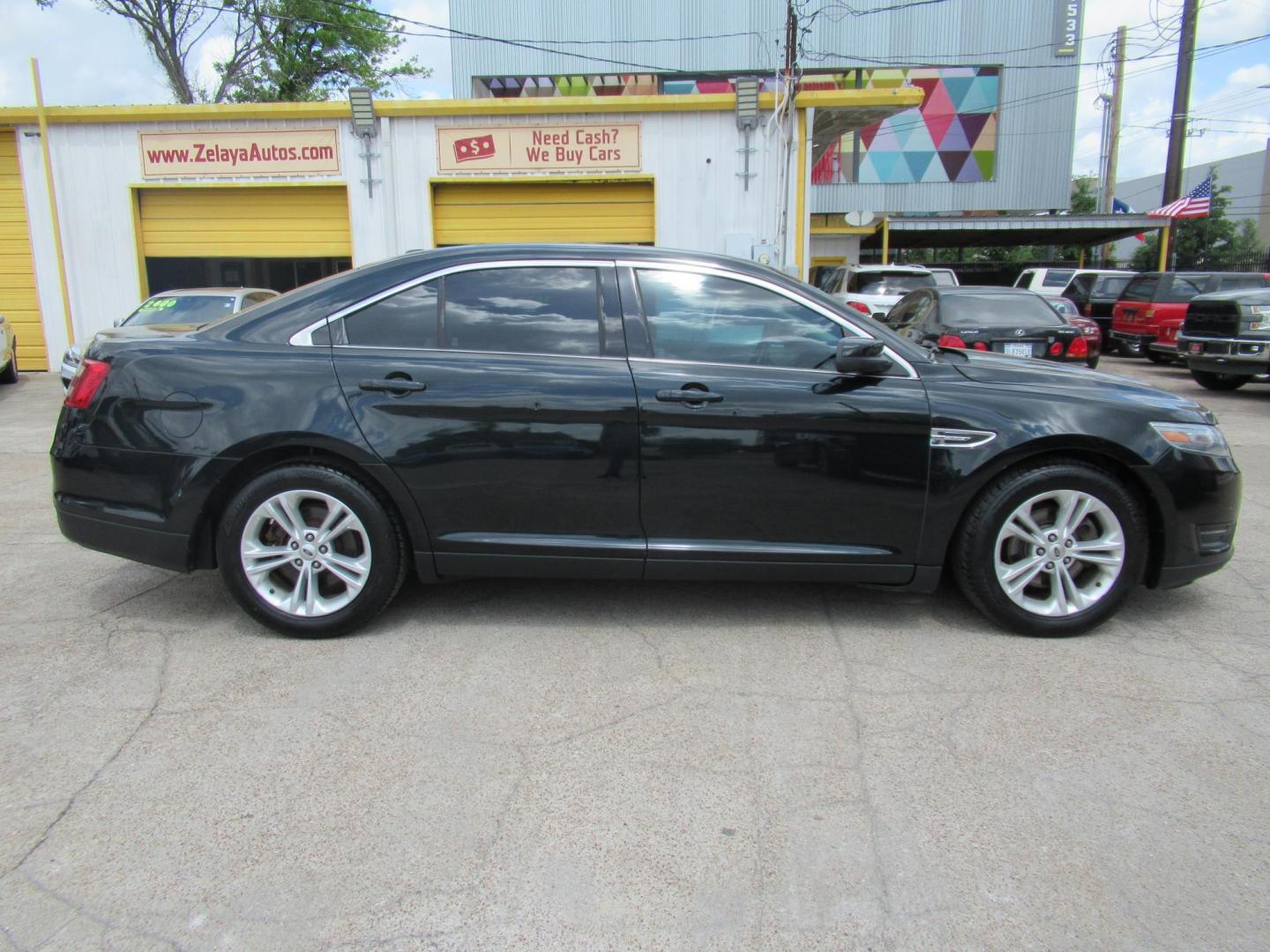 2014 Green /Tan Ford Taurus SEL FWD (1FAHP2E84EG) with an 3.5L V6 DOHC 24V engine, Automatic transmission, located at 1511 North Shepherd Dr., Houston, TX, 77008, (281) 657-1221, 29.798361, -95.412560 - 2014 Ford Taurus Sel 108,699 mi VIN: 1FAHP2E84EG109641 Original Window Sticker Vehicle Details Sedan 4 DR 3.5L V6 F DOHC 24V Gasoline Front wheel drive - Photo#0