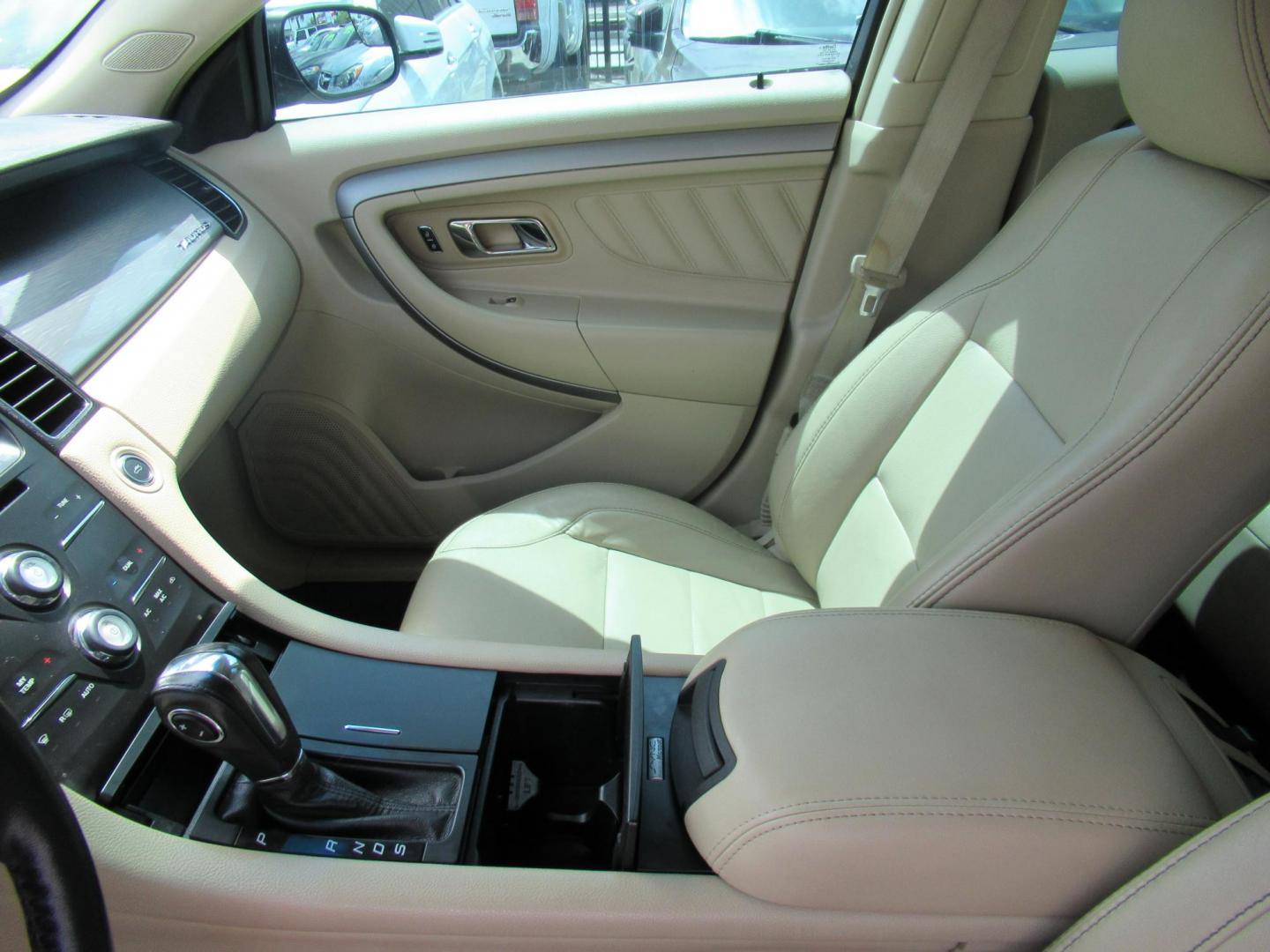 2014 Green /Tan Ford Taurus SEL FWD (1FAHP2E84EG) with an 3.5L V6 DOHC 24V engine, Automatic transmission, located at 1511 North Shepherd Dr., Houston, TX, 77008, (281) 657-1221, 29.798361, -95.412560 - 2014 Ford Taurus Sel 108,699 mi VIN: 1FAHP2E84EG109641 Original Window Sticker Vehicle Details Sedan 4 DR 3.5L V6 F DOHC 24V Gasoline Front wheel drive - Photo#3