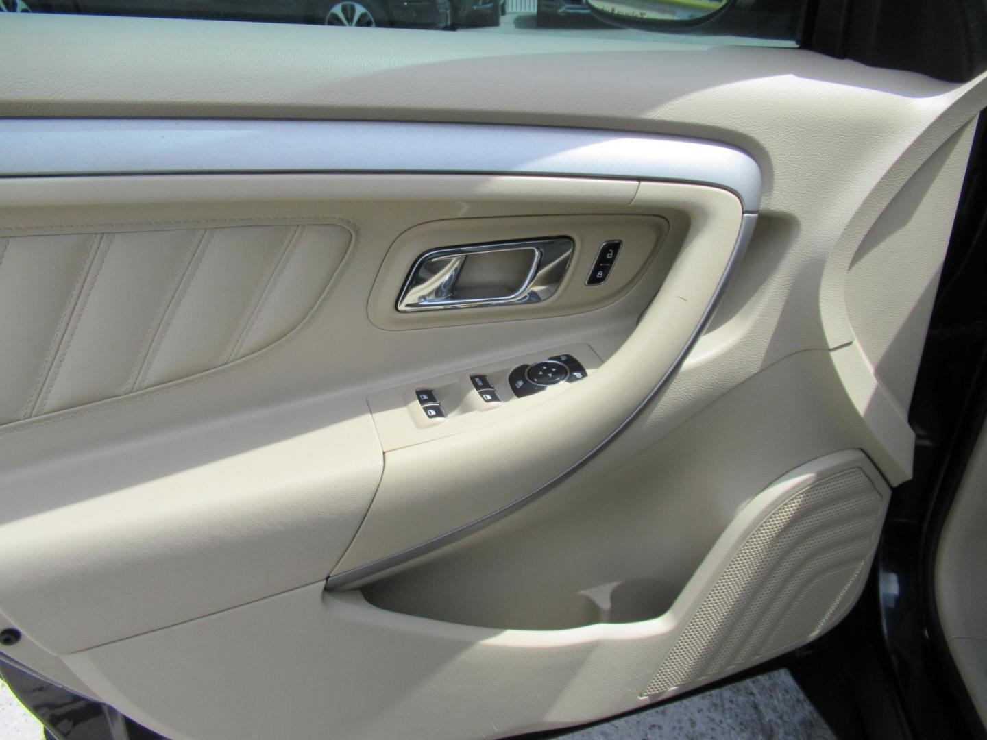 2014 Green /Tan Ford Taurus SEL FWD (1FAHP2E84EG) with an 3.5L V6 DOHC 24V engine, Automatic transmission, located at 1511 North Shepherd Dr., Houston, TX, 77008, (281) 657-1221, 29.798361, -95.412560 - 2014 Ford Taurus Sel 108,699 mi VIN: 1FAHP2E84EG109641 Original Window Sticker Vehicle Details Sedan 4 DR 3.5L V6 F DOHC 24V Gasoline Front wheel drive - Photo#4