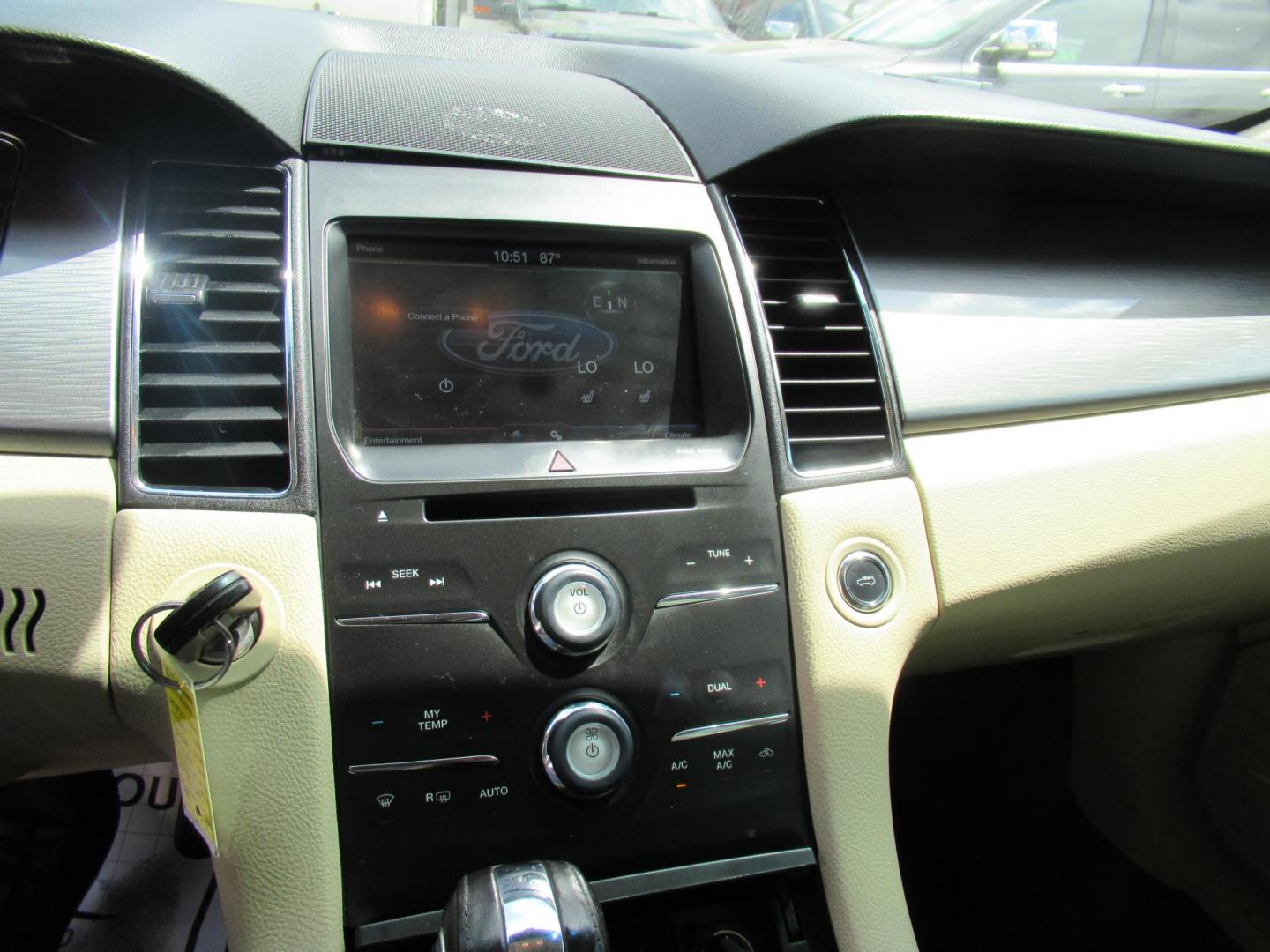 2014 Green /Tan Ford Taurus SEL FWD (1FAHP2E84EG) with an 3.5L V6 DOHC 24V engine, Automatic transmission, located at 1511 North Shepherd Dr., Houston, TX, 77008, (281) 657-1221, 29.798361, -95.412560 - 2014 Ford Taurus Sel 108,699 mi VIN: 1FAHP2E84EG109641 Original Window Sticker Vehicle Details Sedan 4 DR 3.5L V6 F DOHC 24V Gasoline Front wheel drive - Photo#8