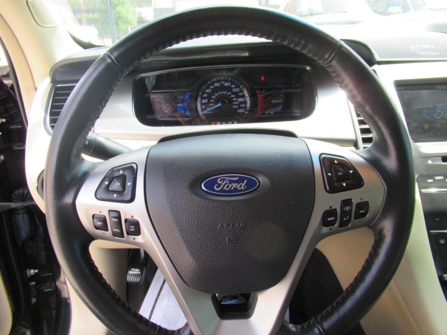 2014 Green /Tan Ford Taurus SEL FWD (1FAHP2E84EG) with an 3.5L V6 DOHC 24V engine, Automatic transmission, located at 1511 North Shepherd Dr., Houston, TX, 77008, (281) 657-1221, 29.798361, -95.412560 - 2014 Ford Taurus Sel 108,699 mi VIN: 1FAHP2E84EG109641 Original Window Sticker Vehicle Details Sedan 4 DR 3.5L V6 F DOHC 24V Gasoline Front wheel drive - Photo#7