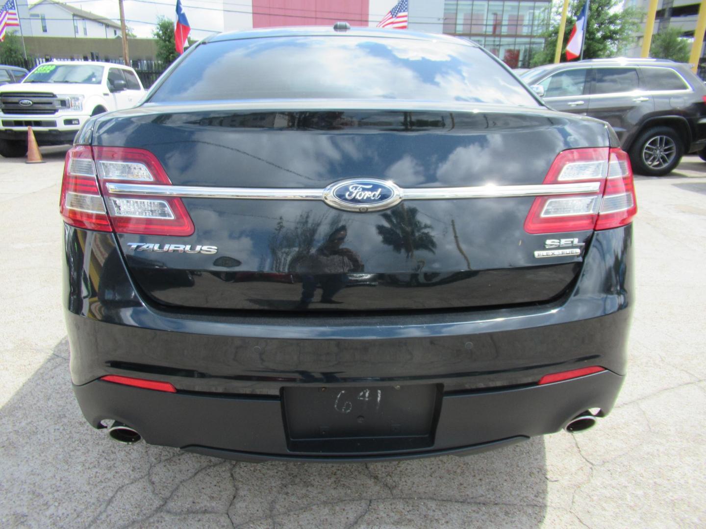 2014 Green /Tan Ford Taurus SEL FWD (1FAHP2E84EG) with an 3.5L V6 DOHC 24V engine, Automatic transmission, located at 1511 North Shepherd Dr., Houston, TX, 77008, (281) 657-1221, 29.798361, -95.412560 - 2014 Ford Taurus Sel 108,699 mi VIN: 1FAHP2E84EG109641 Original Window Sticker Vehicle Details Sedan 4 DR 3.5L V6 F DOHC 24V Gasoline Front wheel drive - Photo#10