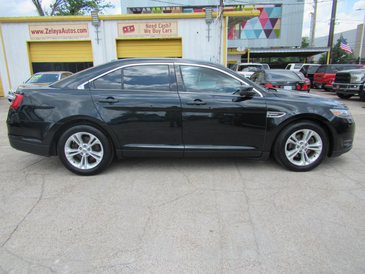 2014 Green /Tan Ford Taurus SEL FWD (1FAHP2E84EG) with an 3.5L V6 DOHC 24V engine, Automatic transmission, located at 1511 North Shepherd Dr., Houston, TX, 77008, (281) 657-1221, 29.798361, -95.412560 - 2014 Ford Taurus Sel 108,699 mi VIN: 1FAHP2E84EG109641 Original Window Sticker Vehicle Details Sedan 4 DR 3.5L V6 F DOHC 24V Gasoline Front wheel drive - Photo#12