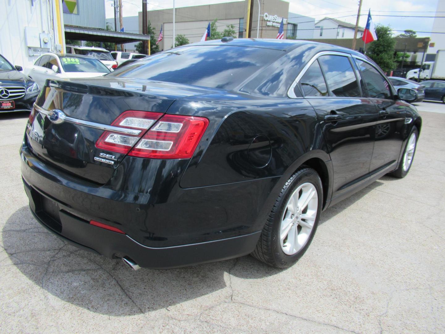 2014 Green /Tan Ford Taurus SEL FWD (1FAHP2E84EG) with an 3.5L V6 DOHC 24V engine, Automatic transmission, located at 1511 North Shepherd Dr., Houston, TX, 77008, (281) 657-1221, 29.798361, -95.412560 - 2014 Ford Taurus Sel 108,699 mi VIN: 1FAHP2E84EG109641 Original Window Sticker Vehicle Details Sedan 4 DR 3.5L V6 F DOHC 24V Gasoline Front wheel drive - Photo#11