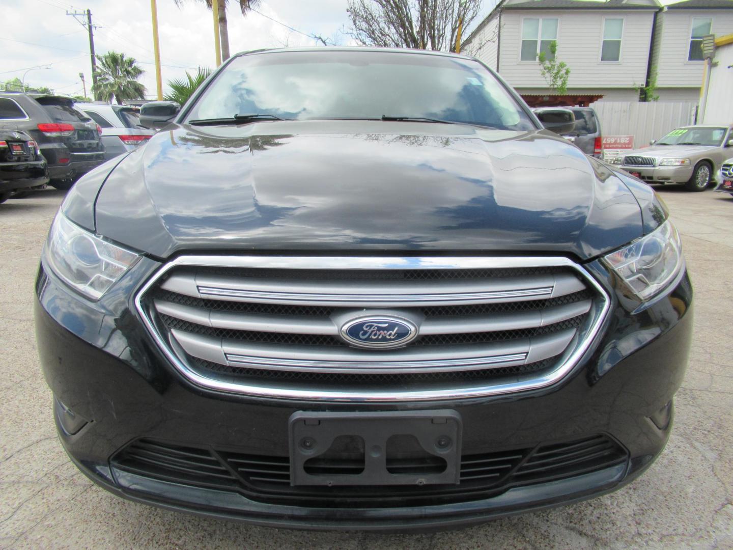 2014 Green /Tan Ford Taurus SEL FWD (1FAHP2E84EG) with an 3.5L V6 DOHC 24V engine, Automatic transmission, located at 1511 North Shepherd Dr., Houston, TX, 77008, (281) 657-1221, 29.798361, -95.412560 - 2014 Ford Taurus Sel 108,699 mi VIN: 1FAHP2E84EG109641 Original Window Sticker Vehicle Details Sedan 4 DR 3.5L V6 F DOHC 24V Gasoline Front wheel drive - Photo#14