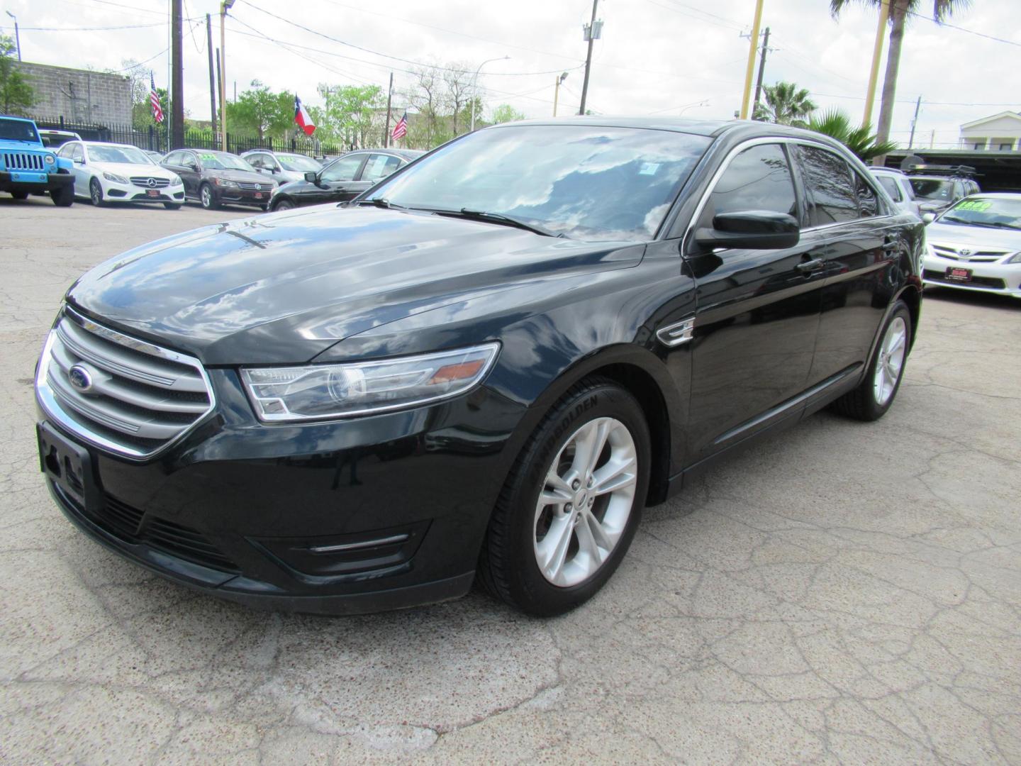 2014 Green /Tan Ford Taurus SEL FWD (1FAHP2E84EG) with an 3.5L V6 DOHC 24V engine, Automatic transmission, located at 1511 North Shepherd Dr., Houston, TX, 77008, (281) 657-1221, 29.798361, -95.412560 - 2014 Ford Taurus Sel 108,699 mi VIN: 1FAHP2E84EG109641 Original Window Sticker Vehicle Details Sedan 4 DR 3.5L V6 F DOHC 24V Gasoline Front wheel drive - Photo#15
