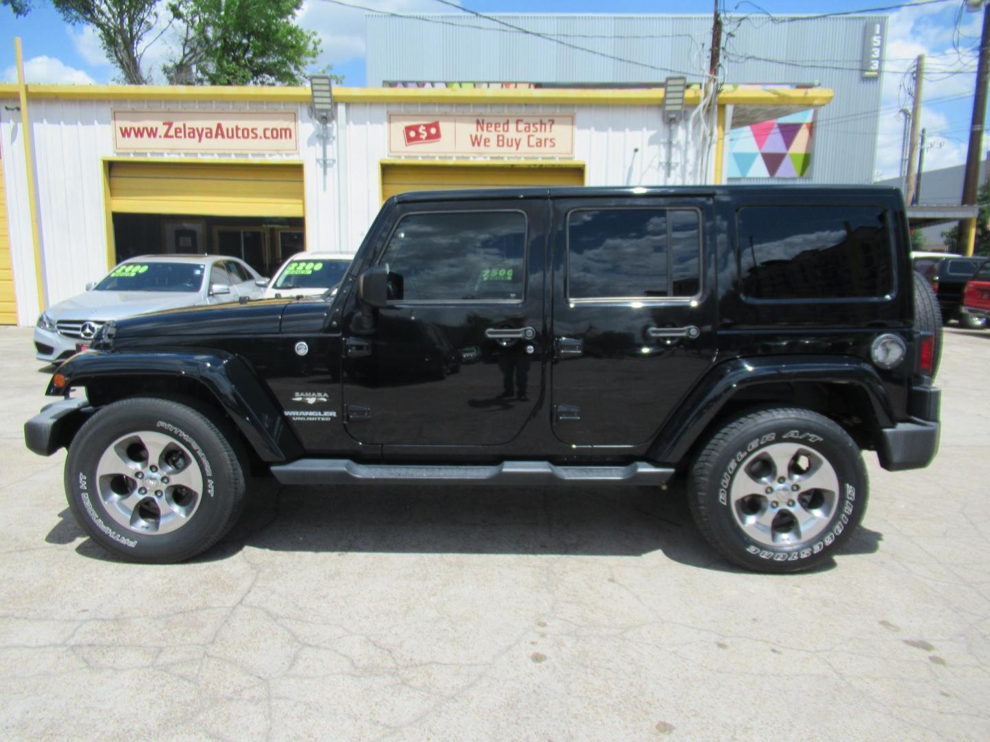 2016 Black /Black Jeep Wrangler Unlimited Sahara 4WD (1C4BJWEG3GL) with an 3.6L V6 DOHC 24V FFV engine, Automatic transmission, located at 1511 North Shepherd Dr., Houston, TX, 77008, (281) 657-1221, 29.798361, -95.412560 - 2016 Jeep Wrangler Unlimited Sahara 117,255 mi VIN: 1C4BJWEG3GL173289 Vehicle Details 4 Door Wagon/Sport Utility 3.6L V6 F DOHC 24V Gasoline Rear wheel drive w/ 4X4 - Photo#0