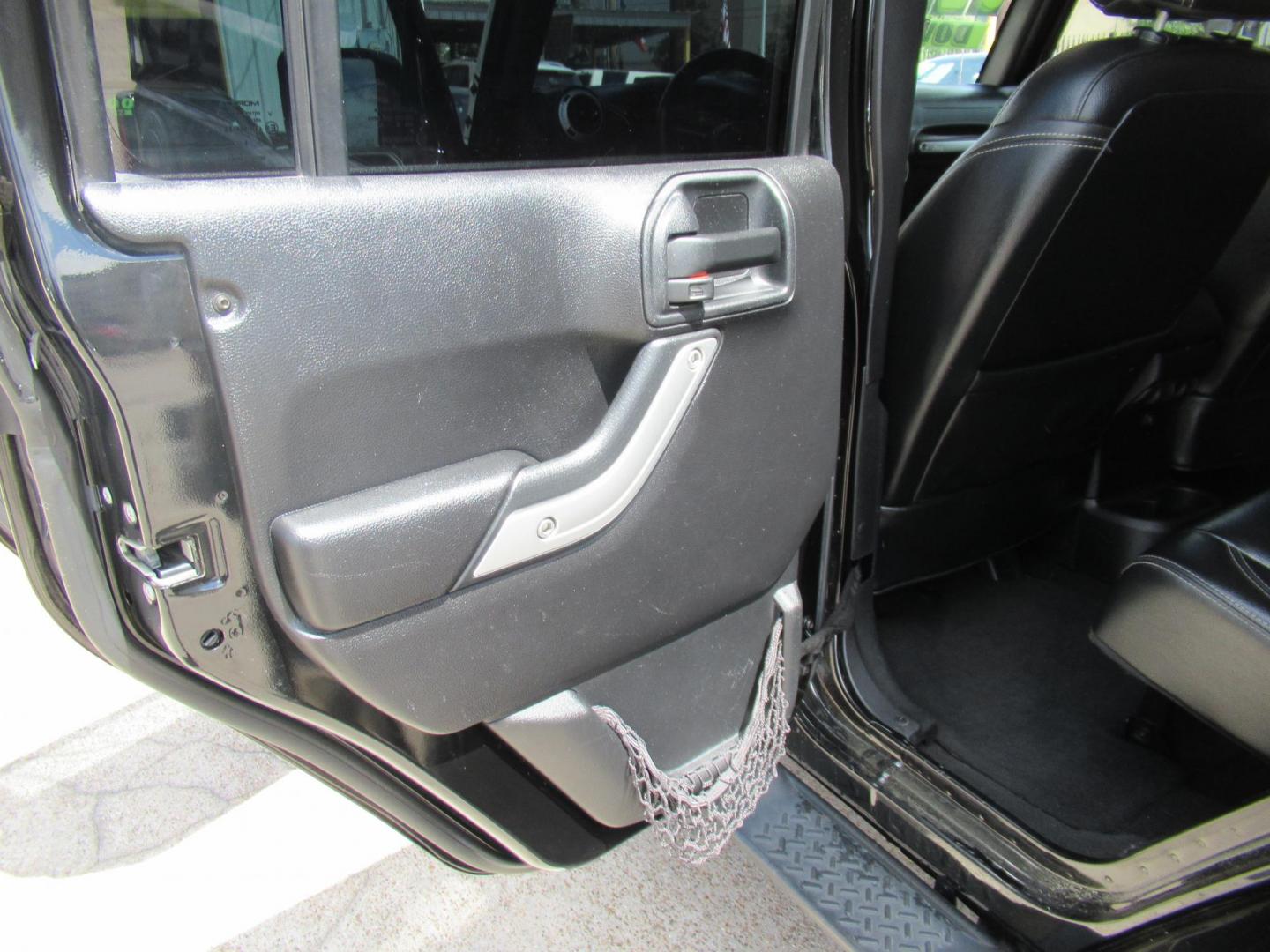 2016 Black /Black Jeep Wrangler Unlimited Sahara 4WD (1C4BJWEG3GL) with an 3.6L V6 DOHC 24V FFV engine, Automatic transmission, located at 1511 North Shepherd Dr., Houston, TX, 77008, (281) 657-1221, 29.798361, -95.412560 - 2016 Jeep Wrangler Unlimited Sahara 117,255 mi VIN: 1C4BJWEG3GL173289 Vehicle Details 4 Door Wagon/Sport Utility 3.6L V6 F DOHC 24V Gasoline Rear wheel drive w/ 4X4 - Photo#10