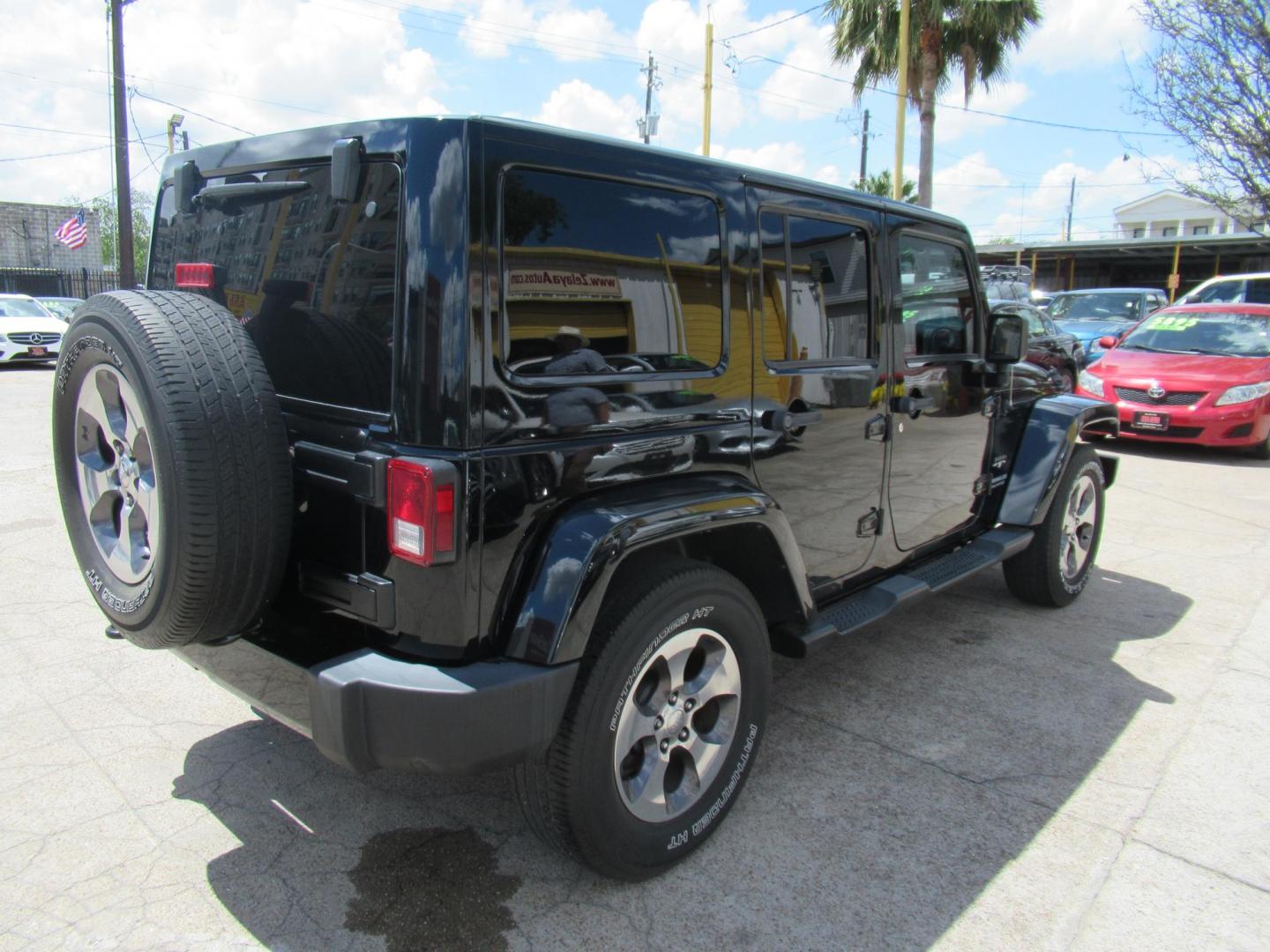 2016 Black /Black Jeep Wrangler Unlimited Sahara 4WD (1C4BJWEG3GL) with an 3.6L V6 DOHC 24V FFV engine, Automatic transmission, located at 1511 North Shepherd Dr., Houston, TX, 77008, (281) 657-1221, 29.798361, -95.412560 - 2016 Jeep Wrangler Unlimited Sahara 117,255 mi VIN: 1C4BJWEG3GL173289 Vehicle Details 4 Door Wagon/Sport Utility 3.6L V6 F DOHC 24V Gasoline Rear wheel drive w/ 4X4 - Photo#22