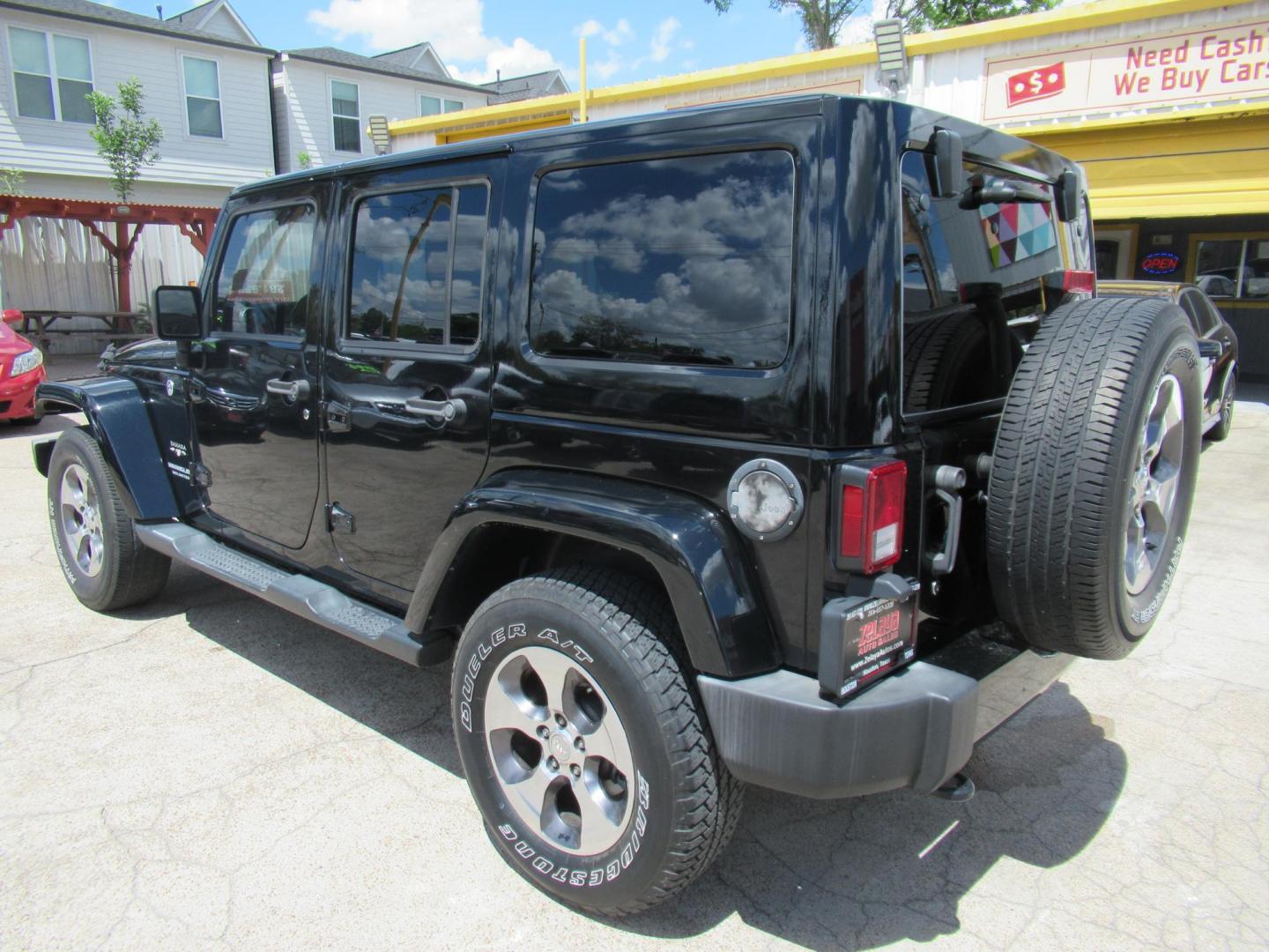 2016 Black /Black Jeep Wrangler Unlimited Sahara 4WD (1C4BJWEG3GL) with an 3.6L V6 DOHC 24V FFV engine, Automatic transmission, located at 1511 North Shepherd Dr., Houston, TX, 77008, (281) 657-1221, 29.798361, -95.412560 - 2016 Jeep Wrangler Unlimited Sahara 117,255 mi VIN: 1C4BJWEG3GL173289 Vehicle Details 4 Door Wagon/Sport Utility 3.6L V6 F DOHC 24V Gasoline Rear wheel drive w/ 4X4 - Photo#24