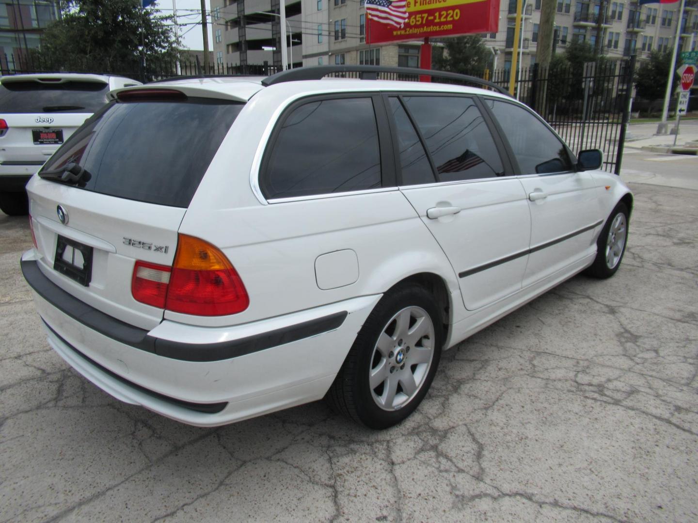 2004 White /Tan BMW 3-Series Sport Wagon 325xi (WBAEP33484P) with an 2.5L L6 DOHC 24V engine, located at 1511 North Shepherd Dr., Houston, TX, 77008, (281) 657-1221, 29.798361, -95.412560 - 2004 BMW 3 Series 325XI 81,305 mi VIN: WBAEP33484PF04486 Vehicle Details Wagon 4 DR 2.5L I6 F DOHC 24V Gasoline All wheel drive - Photo#29