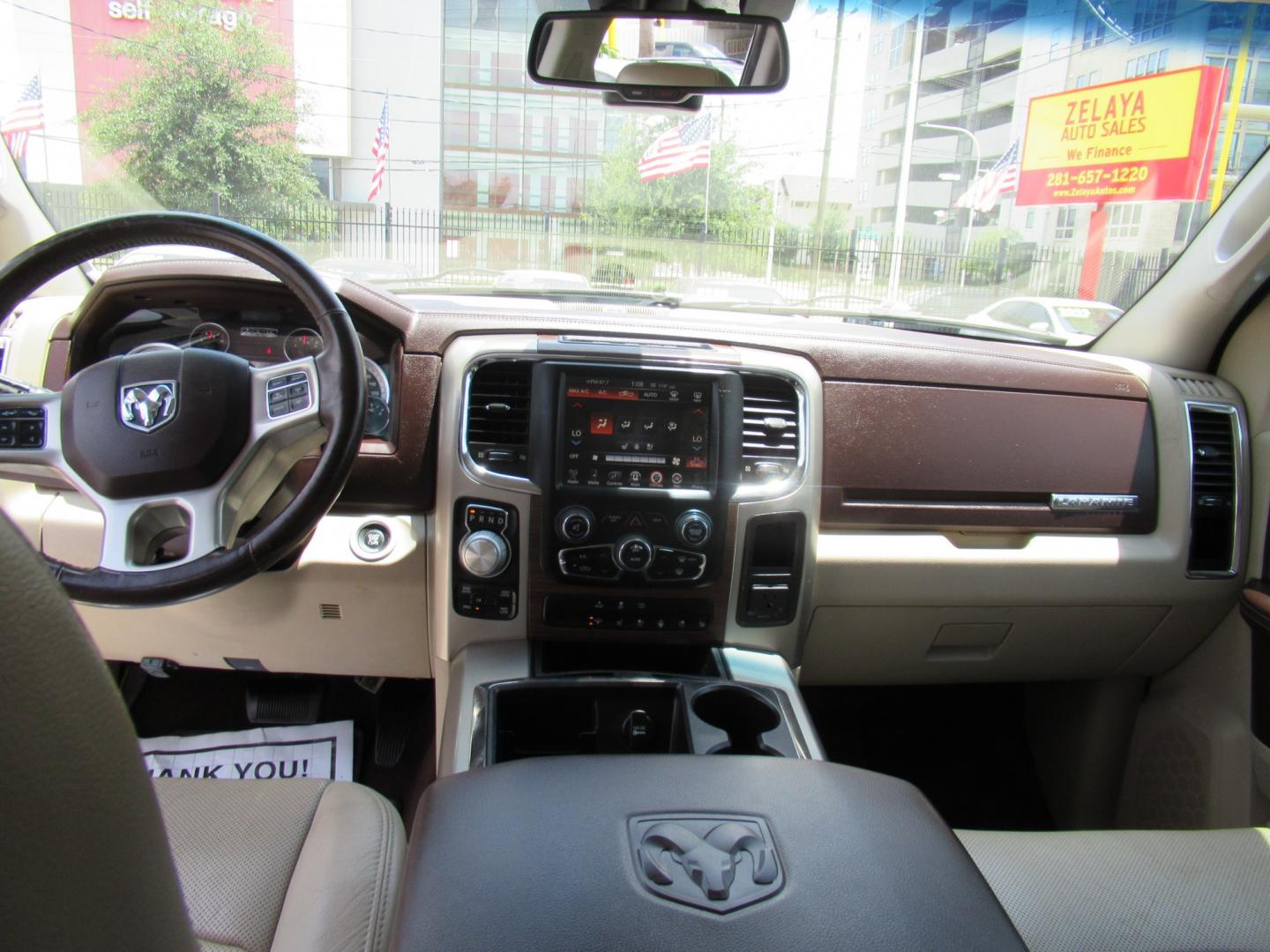 2015 White /Brown RAM 1500 Laramie Crew Cab SWB 4WD (1C6RR7NT9FS) with an 5.7L V8 OHV 16V engine, 6-Speed Automatic transmission, located at 1511 North Shepherd Dr., Houston, TX, 77008, (281) 657-1221, 29.798361, -95.412560 - 2015 Ram 1500 Laramie 145,729 miles VIN: 1C6RR7NT9FS513258 Vehicle Details Crew Pickup 5.7L V8 F OHV 16V Gasoline Rear wheel drive w/ 4X4- Photo#12