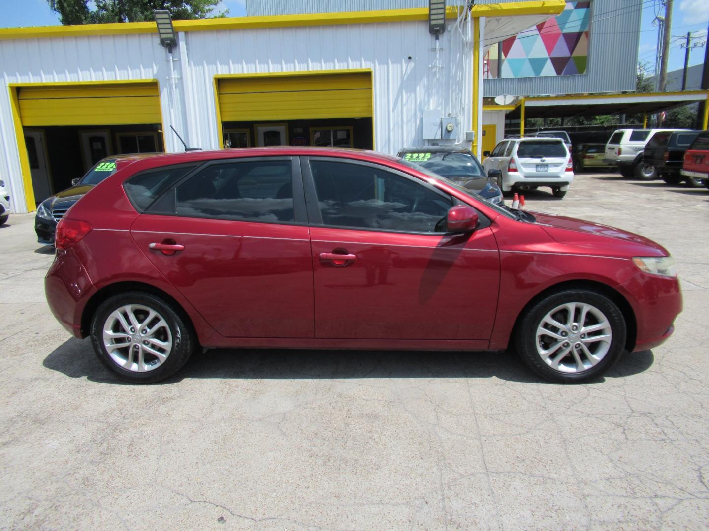 2011 Red /Black Kia Forte 5-Door EX (KNAFU5A24B5) with an 2.0L L4 DOHC 16V engine, Automatic transmission, located at 1511 North Shepherd Dr., Houston, TX, 77008, (281) 657-1221, 29.798361, -95.412560 - 2011 Kia Forte5 EX 135,659 miles VIN: KNAFU5A24B5320128 Vehicle Details Hatchback 4 DR 2.0L I4 F DOHC 16V Gasoline Front wheel drive- Photo#0