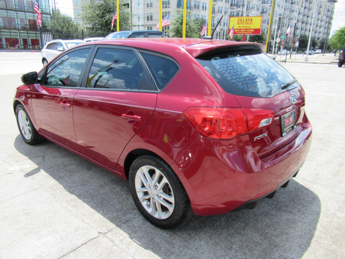 2011 Red /Black Kia Forte 5-Door EX (KNAFU5A24B5) with an 2.0L L4 DOHC 16V engine, Automatic transmission, located at 1511 North Shepherd Dr., Houston, TX, 77008, (281) 657-1221, 29.798361, -95.412560 - 2011 Kia Forte5 EX 135,659 miles VIN: KNAFU5A24B5320128 Vehicle Details Hatchback 4 DR 2.0L I4 F DOHC 16V Gasoline Front wheel drive- Photo#18
