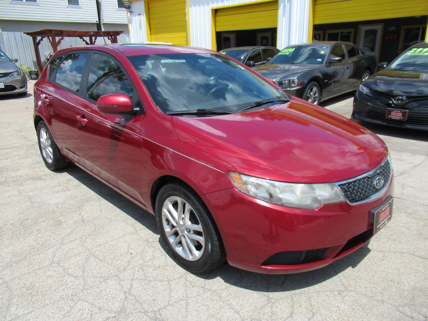 2011 Red /Black Kia Forte 5-Door EX (KNAFU5A24B5) with an 2.0L L4 DOHC 16V engine, Automatic transmission, located at 1511 North Shepherd Dr., Houston, TX, 77008, (281) 657-1221, 29.798361, -95.412560 - 2011 Kia Forte5 EX 135,659 miles VIN: KNAFU5A24B5320128 Vehicle Details Hatchback 4 DR 2.0L I4 F DOHC 16V Gasoline Front wheel drive- Photo#22