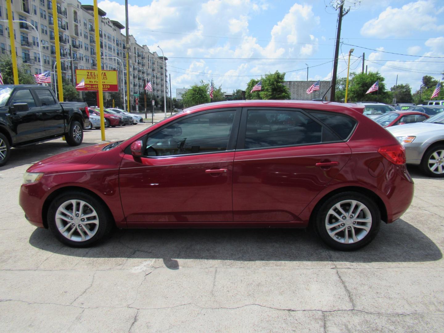 2011 Red /Black Kia Forte 5-Door EX (KNAFU5A24B5) with an 2.0L L4 DOHC 16V engine, Automatic transmission, located at 1511 North Shepherd Dr., Houston, TX, 77008, (281) 657-1221, 29.798361, -95.412560 - 2011 Kia Forte5 EX 135,659 miles VIN: KNAFU5A24B5320128 Vehicle Details Hatchback 4 DR 2.0L I4 F DOHC 16V Gasoline Front wheel drive- Photo#24
