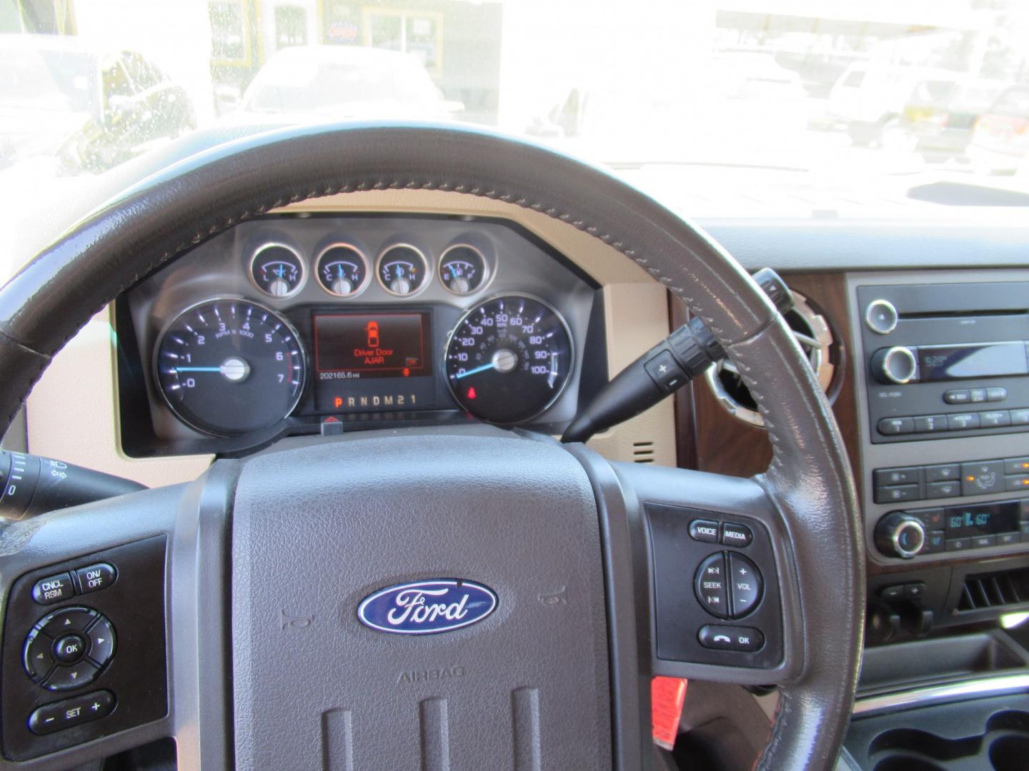 2012 Green /Tan Ford F-250 SD King Ranch Crew Cab 4WD (1FT7W2B62CE) with an 6.2L V8 OHV 16V engine, 6-Speed Automatic transmission, located at 1511 North Shepherd Dr., Houston, TX, 77008, (281) 657-1221, 29.798361, -95.412560 - 2012 Ford F-250 Super Duty Lariat 202,134 miles VIN: 1FT7W2B62CEA02897 Details Crew Pickup 6.2L V8 F SOHC 16V Gasoline Rear wheel drive w/ 4X4- Photo#9