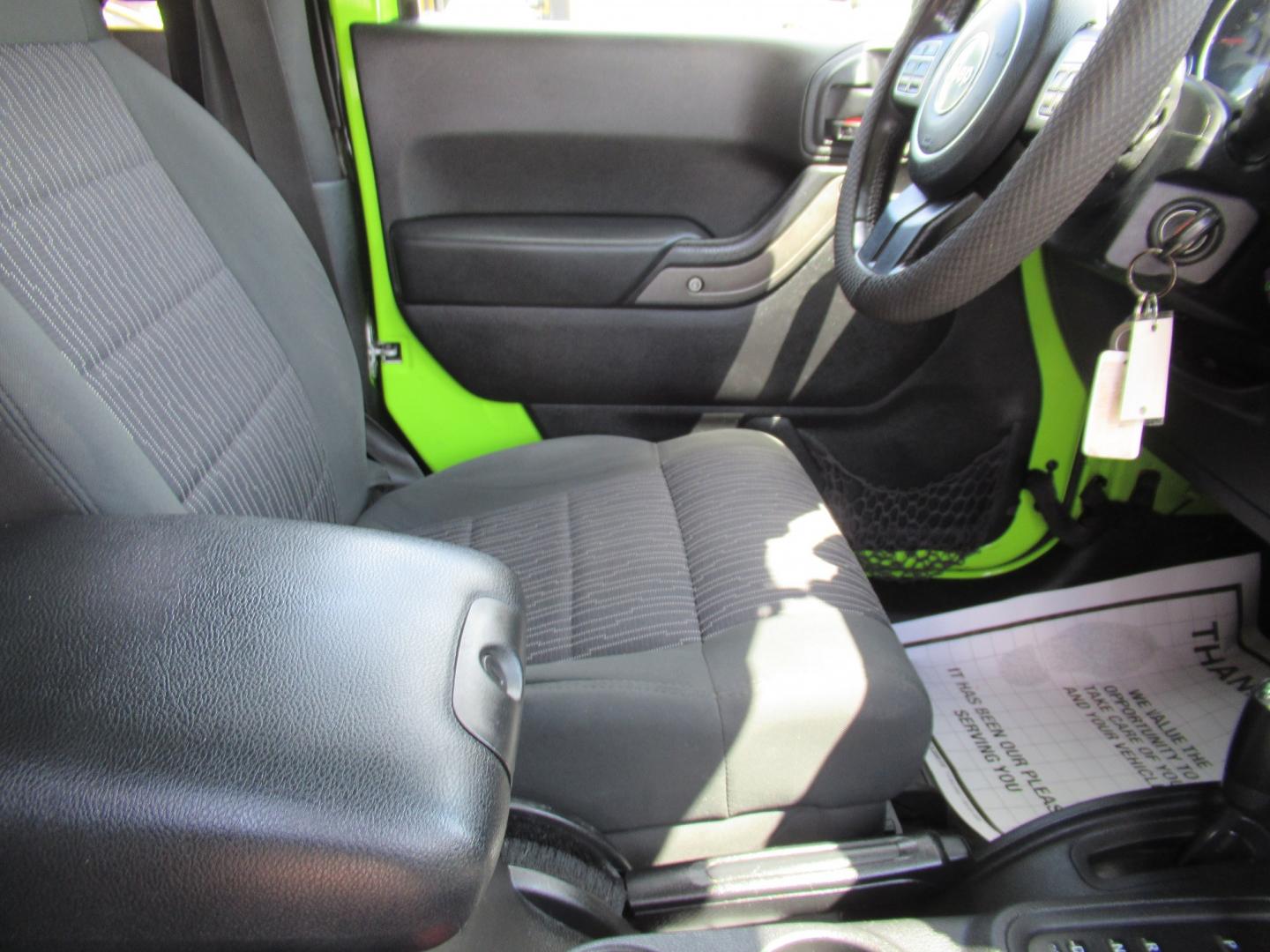 2012 Green /Black Jeep Wrangler Sport 4WD (1C4AJWAG0CL) with an 3.6L V6 DOHC 24V FFV engine, Automatic transmission, located at 1511 North Shepherd Dr., Houston, TX, 77008, (281) 657-1221, 29.798361, -95.412560 - 2012 Jeep Wrangler Sport VIN: 1C4AJWAG0CL279419 Vehicle Details Utility (Blazer, Jimmy, Scout, etc.) 3.6L V6 F DOHC 24V Gasoline Rear wheel drive w/ 4X4- Photo#6