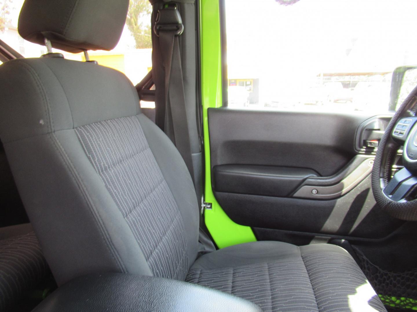 2012 Green /Black Jeep Wrangler Sport 4WD (1C4AJWAG0CL) with an 3.6L V6 DOHC 24V FFV engine, Automatic transmission, located at 1511 North Shepherd Dr., Houston, TX, 77008, (281) 657-1221, 29.798361, -95.412560 - 2012 Jeep Wrangler Sport VIN: 1C4AJWAG0CL279419 Vehicle Details Utility (Blazer, Jimmy, Scout, etc.) 3.6L V6 F DOHC 24V Gasoline Rear wheel drive w/ 4X4- Photo#8