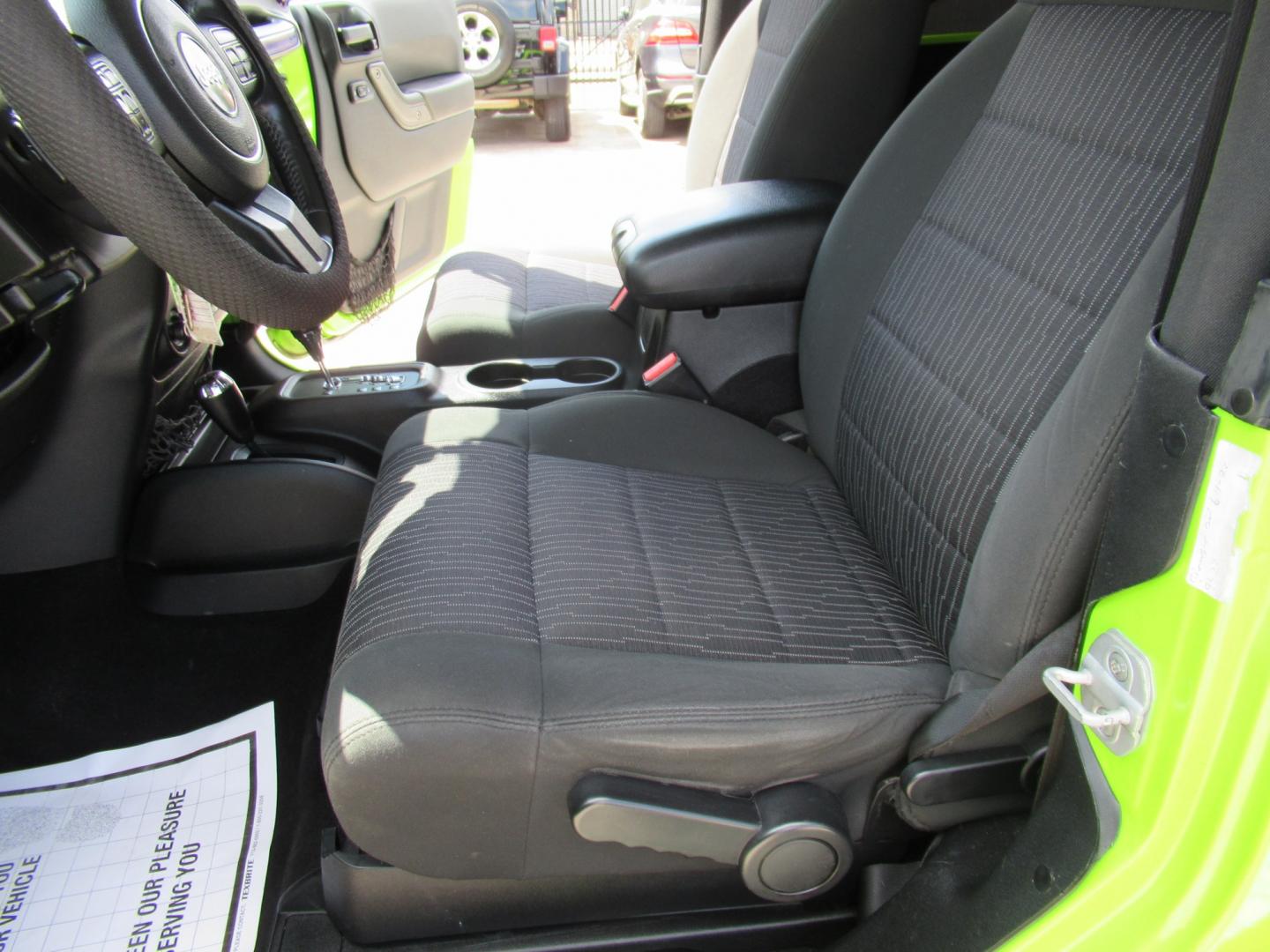 2012 Green /Black Jeep Wrangler Sport 4WD (1C4AJWAG0CL) with an 3.6L V6 DOHC 24V FFV engine, Automatic transmission, located at 1511 North Shepherd Dr., Houston, TX, 77008, (281) 657-1221, 29.798361, -95.412560 - 2012 Jeep Wrangler Sport VIN: 1C4AJWAG0CL279419 Vehicle Details Utility (Blazer, Jimmy, Scout, etc.) 3.6L V6 F DOHC 24V Gasoline Rear wheel drive w/ 4X4- Photo#10