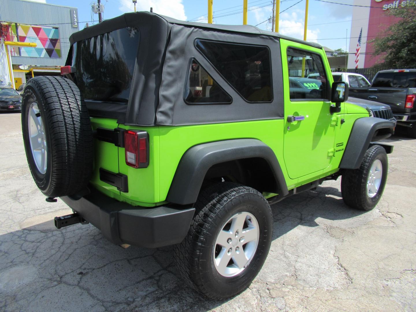 2012 Green /Black Jeep Wrangler Sport 4WD (1C4AJWAG0CL) with an 3.6L V6 DOHC 24V FFV engine, Automatic transmission, located at 1511 North Shepherd Dr., Houston, TX, 77008, (281) 657-1221, 29.798361, -95.412560 - 2012 Jeep Wrangler Sport VIN: 1C4AJWAG0CL279419 Vehicle Details Utility (Blazer, Jimmy, Scout, etc.) 3.6L V6 F DOHC 24V Gasoline Rear wheel drive w/ 4X4- Photo#18