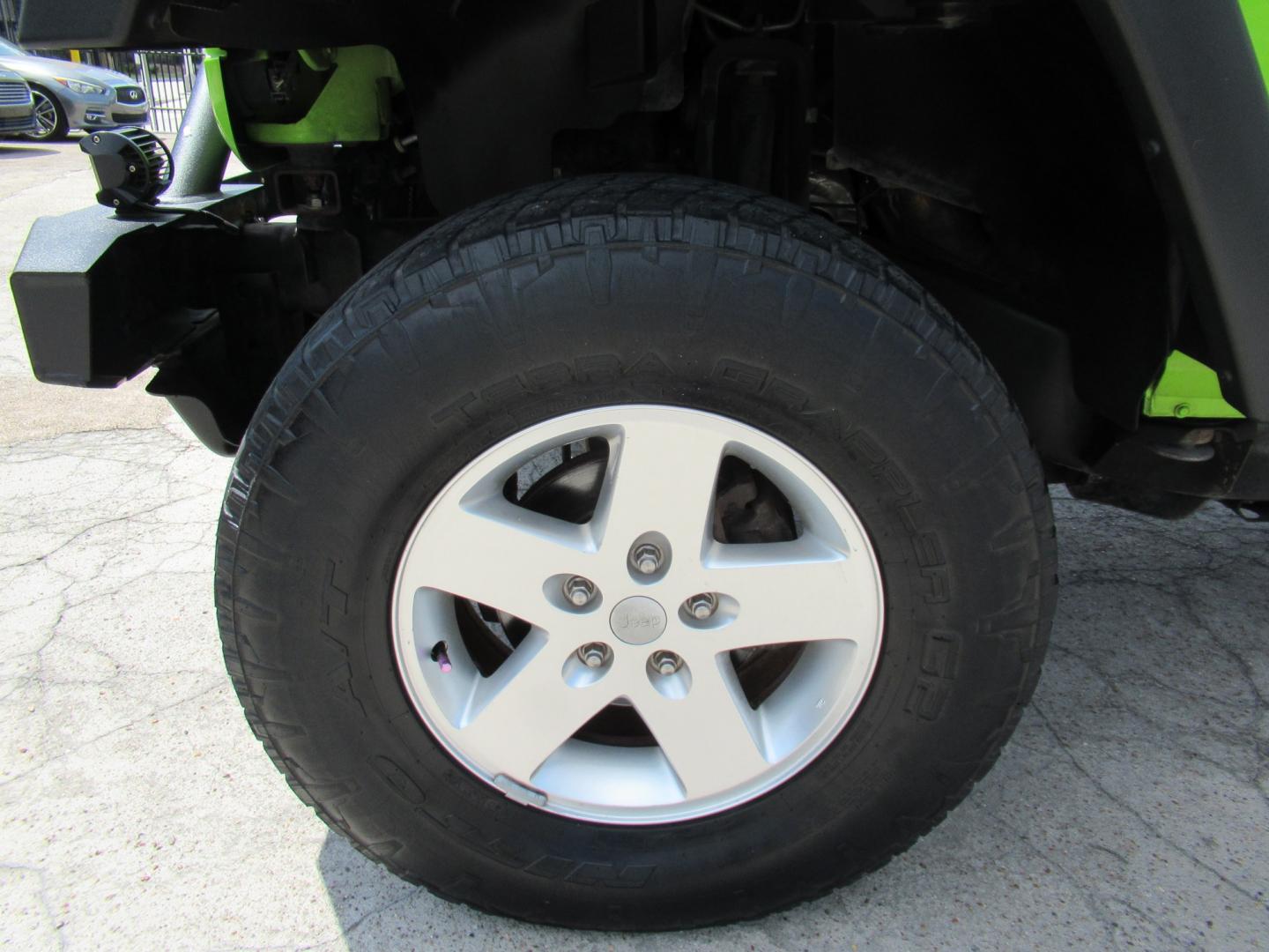 2012 Green /Black Jeep Wrangler Sport 4WD (1C4AJWAG0CL) with an 3.6L V6 DOHC 24V FFV engine, Automatic transmission, located at 1511 North Shepherd Dr., Houston, TX, 77008, (281) 657-1221, 29.798361, -95.412560 - 2012 Jeep Wrangler Sport VIN: 1C4AJWAG0CL279419 Vehicle Details Utility (Blazer, Jimmy, Scout, etc.) 3.6L V6 F DOHC 24V Gasoline Rear wheel drive w/ 4X4- Photo#24