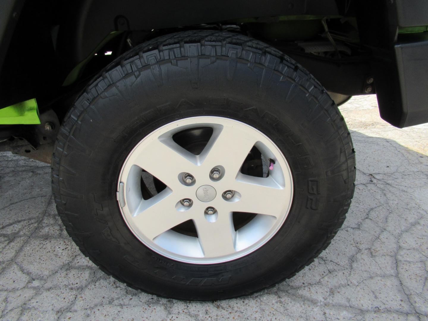 2012 Green /Black Jeep Wrangler Sport 4WD (1C4AJWAG0CL) with an 3.6L V6 DOHC 24V FFV engine, Automatic transmission, located at 1511 North Shepherd Dr., Houston, TX, 77008, (281) 657-1221, 29.798361, -95.412560 - 2012 Jeep Wrangler Sport VIN: 1C4AJWAG0CL279419 Vehicle Details Utility (Blazer, Jimmy, Scout, etc.) 3.6L V6 F DOHC 24V Gasoline Rear wheel drive w/ 4X4- Photo#26