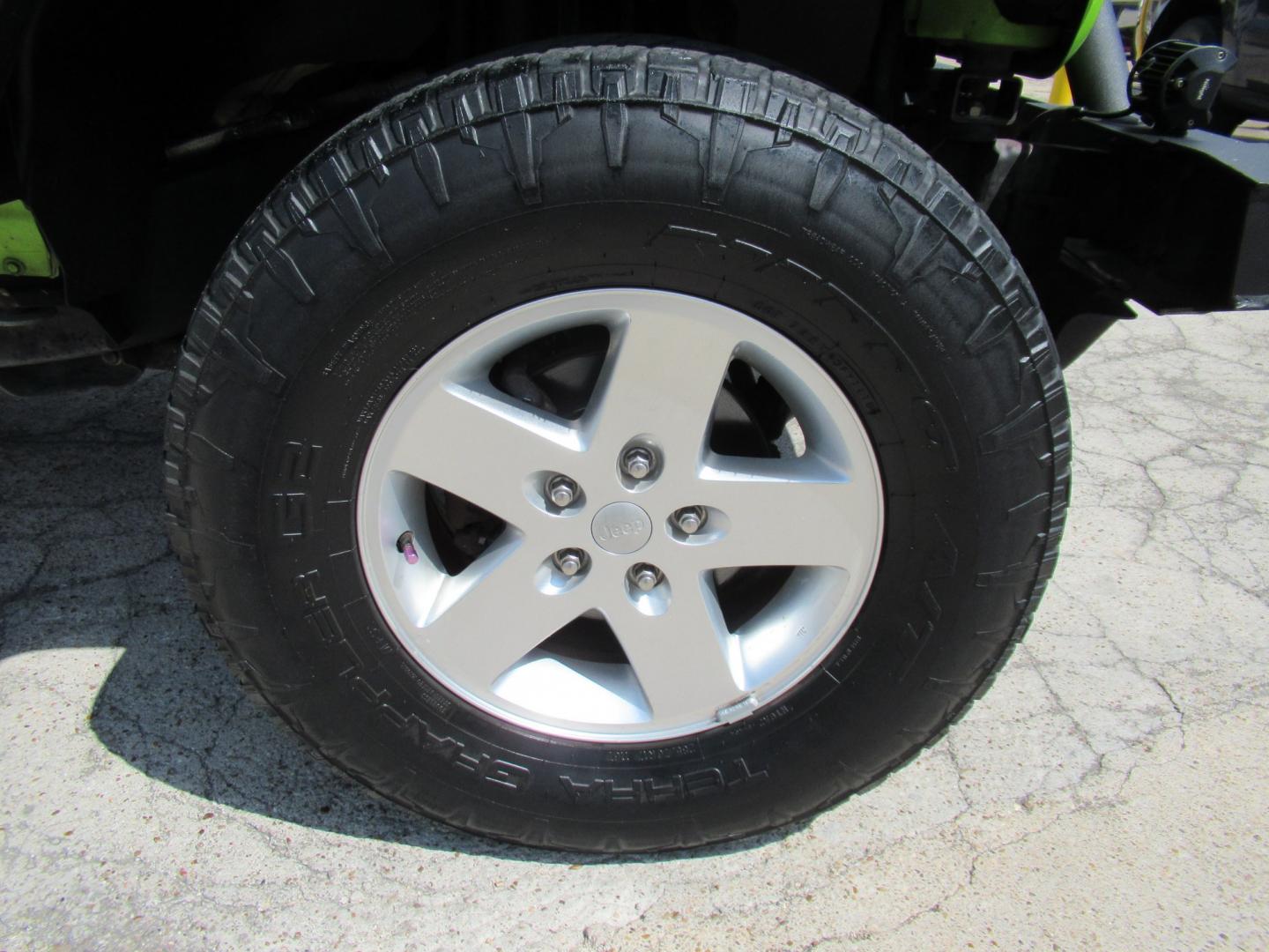 2012 Green /Black Jeep Wrangler Sport 4WD (1C4AJWAG0CL) with an 3.6L V6 DOHC 24V FFV engine, Automatic transmission, located at 1511 North Shepherd Dr., Houston, TX, 77008, (281) 657-1221, 29.798361, -95.412560 - 2012 Jeep Wrangler Sport VIN: 1C4AJWAG0CL279419 Vehicle Details Utility (Blazer, Jimmy, Scout, etc.) 3.6L V6 F DOHC 24V Gasoline Rear wheel drive w/ 4X4- Photo#29