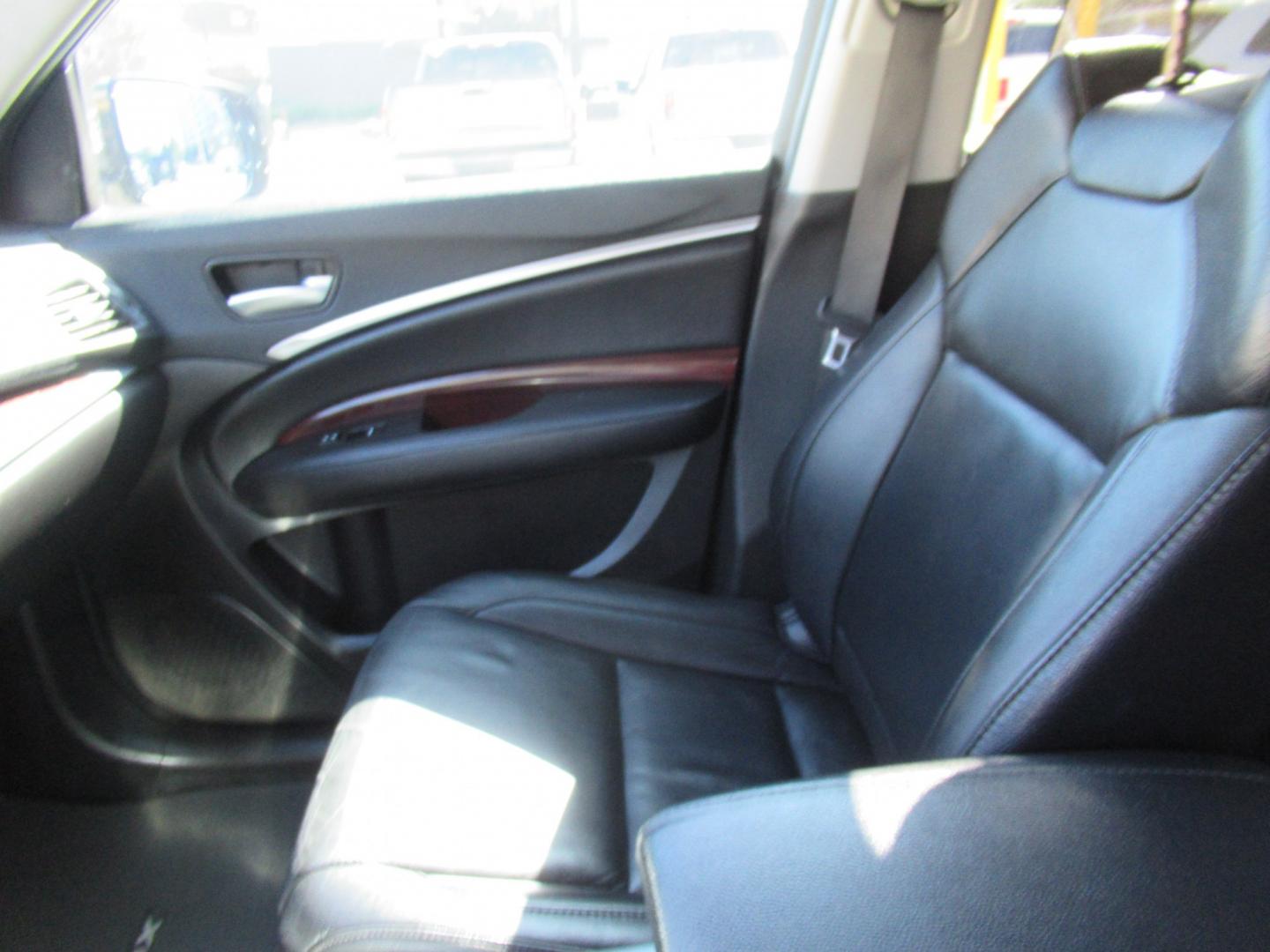 2014 Black /Black Acura MDX 6-Spd AT w/Tech and Entertainment Package (5FRYD3H64EB) with an 3.5L V6 SOHC 24V engine, 6-Speed Automatic transmission, located at 1511 North Shepherd Dr., Houston, TX, 77008, (281) 657-1221, 29.798361, -95.412560 - 2014 Acura MDX W/Tech W/Res VIN: 5FRYD3H64EB010815 Vehicle Details 4 Door Wagon/Sport Utility 3.5L V6 F SOHC 24V Gasoline Front wheel drive- Photo#6