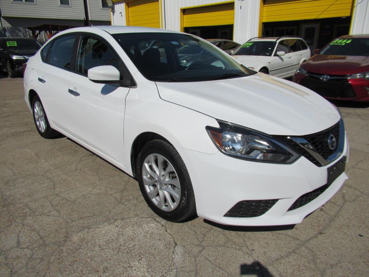 2018 White /Black Nissan Sentra S CVT (3N1AB7APXJL) with an 1.8L L4 SFI DOHC 16V engine, CVT transmission, located at 1511 North Shepherd Dr., Houston, TX, 77008, (281) 657-1221, 29.798361, -95.412560 - 2018 Nissan Sentra SV VIN: 3N1AB7APXJL656510 Vehicle Details Sedan 4 DR 1.8L I4 F DOHC 16V Gasoline Front wheel drive- Photo#19