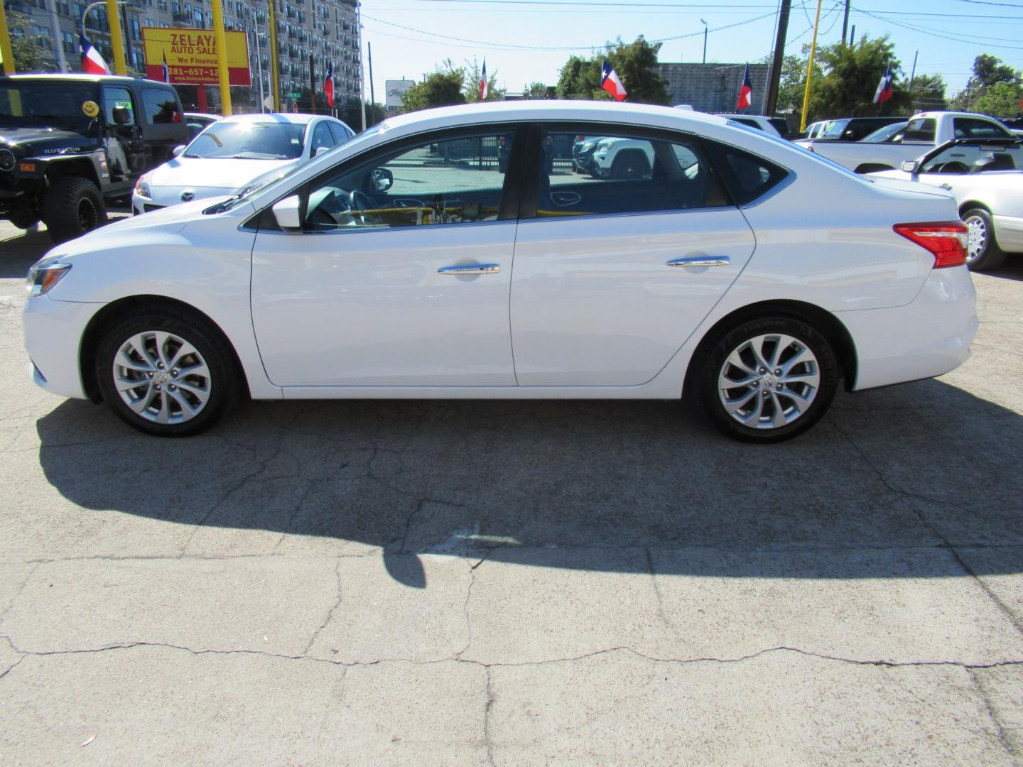 2018 White /Black Nissan Sentra S CVT (3N1AB7APXJL) with an 1.8L L4 SFI DOHC 16V engine, CVT transmission, located at 1511 North Shepherd Dr., Houston, TX, 77008, (281) 657-1221, 29.798361, -95.412560 - 2018 Nissan Sentra SV VIN: 3N1AB7APXJL656510 Vehicle Details Sedan 4 DR 1.8L I4 F DOHC 16V Gasoline Front wheel drive- Photo#22